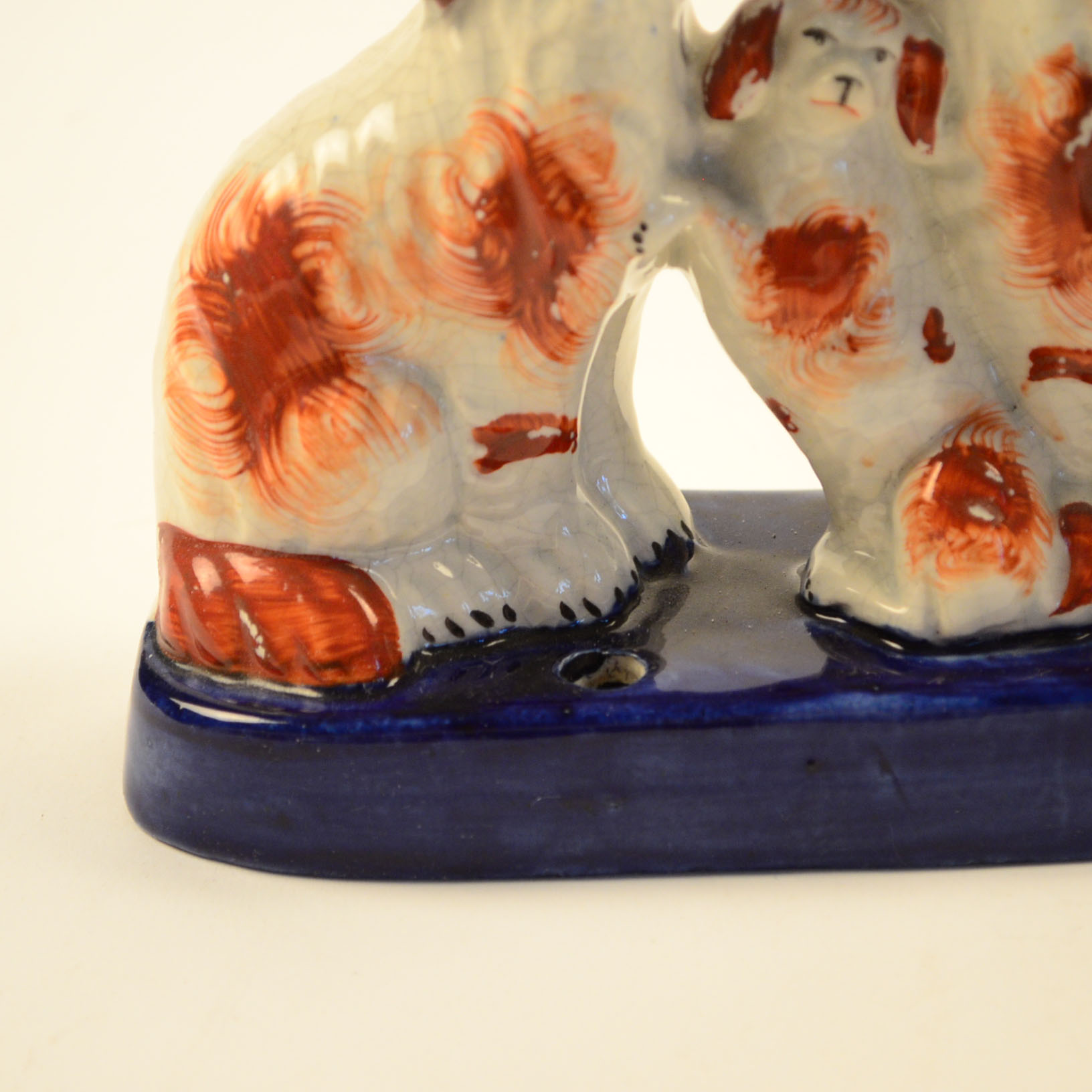 Four Antique and Reproduction Staffordshire Dog Figurines