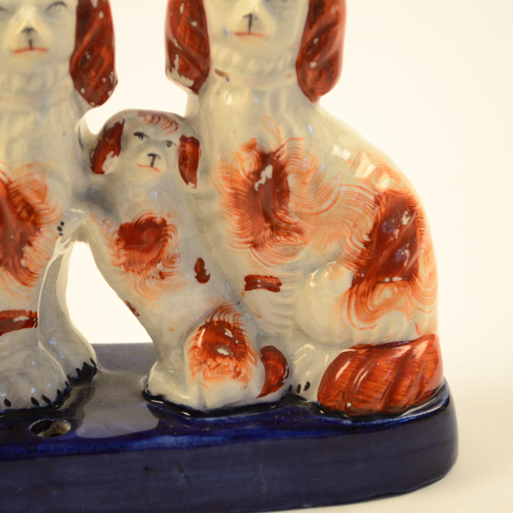Four Antique and Reproduction Staffordshire Dog Figurines