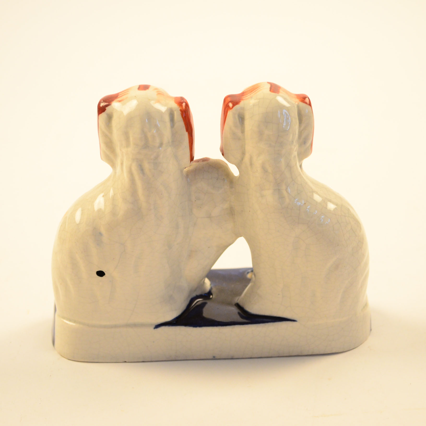 Four Antique and Reproduction Staffordshire Dog Figurines