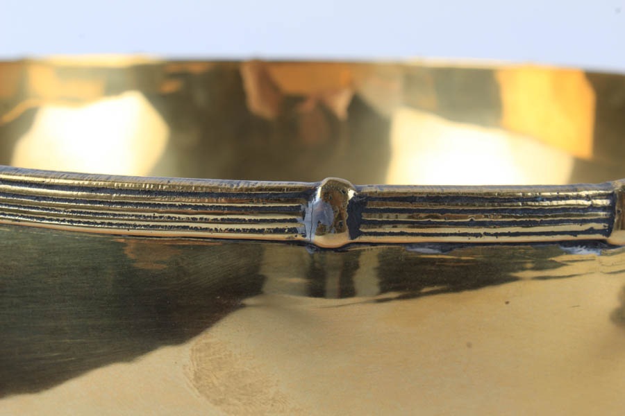 Grouping of Footed Brass Bowl and Candlesticks