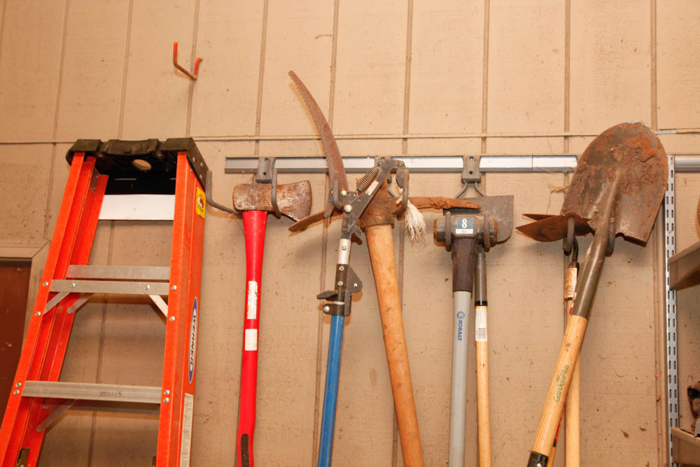 Ladder and Assortment of Garden Tools