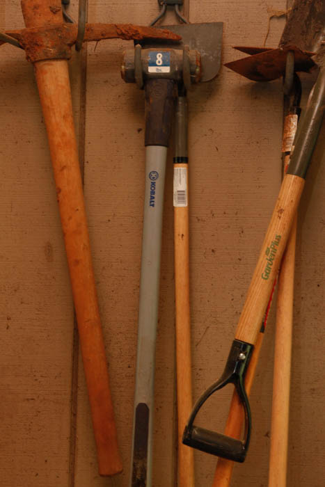 Ladder and Assortment of Garden Tools