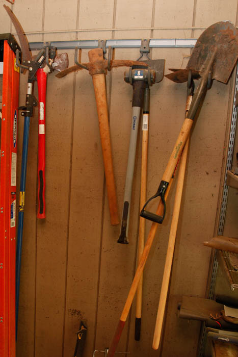 Ladder and Assortment of Garden Tools