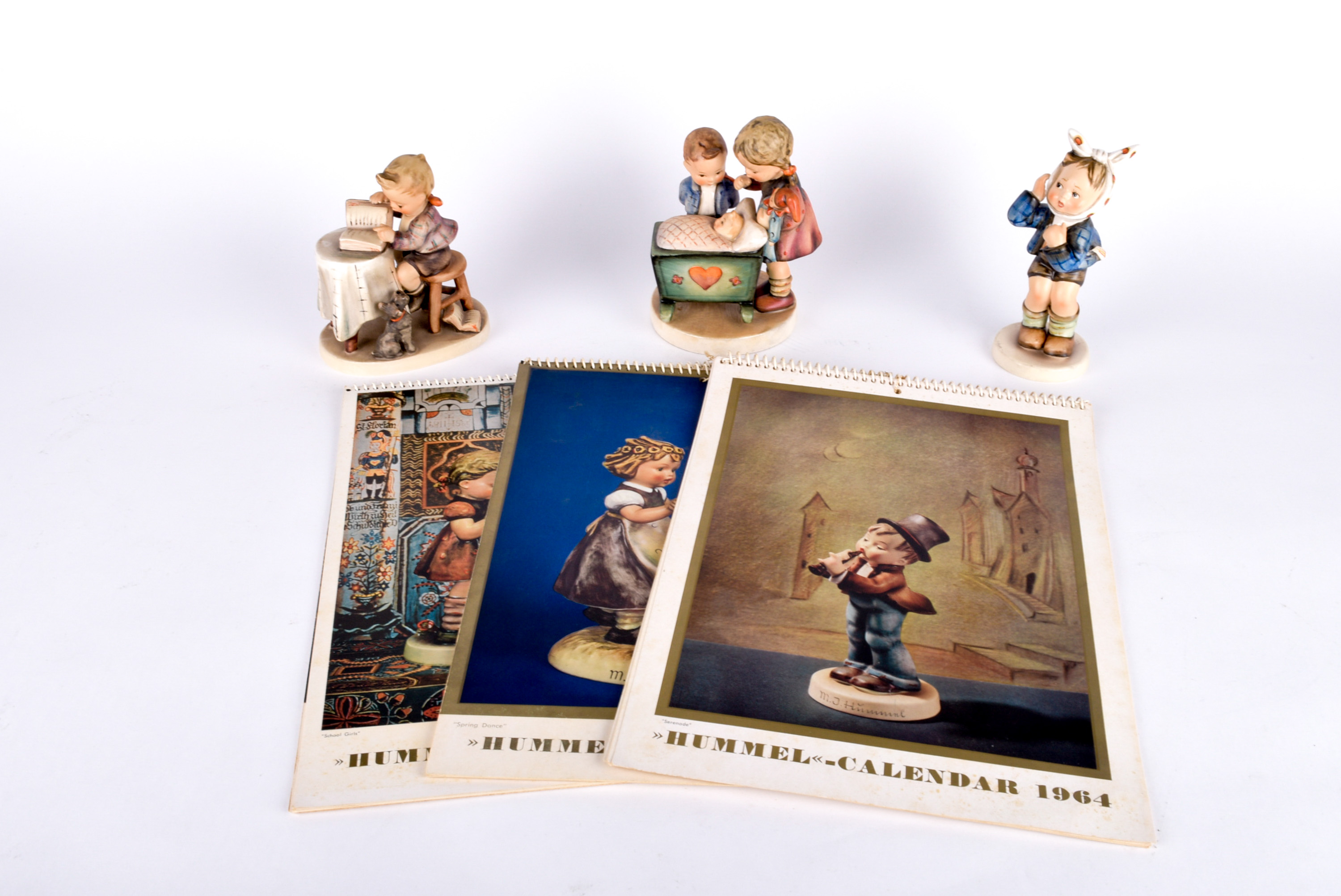 Trio of Hummel Figurines and Vintage Calendars