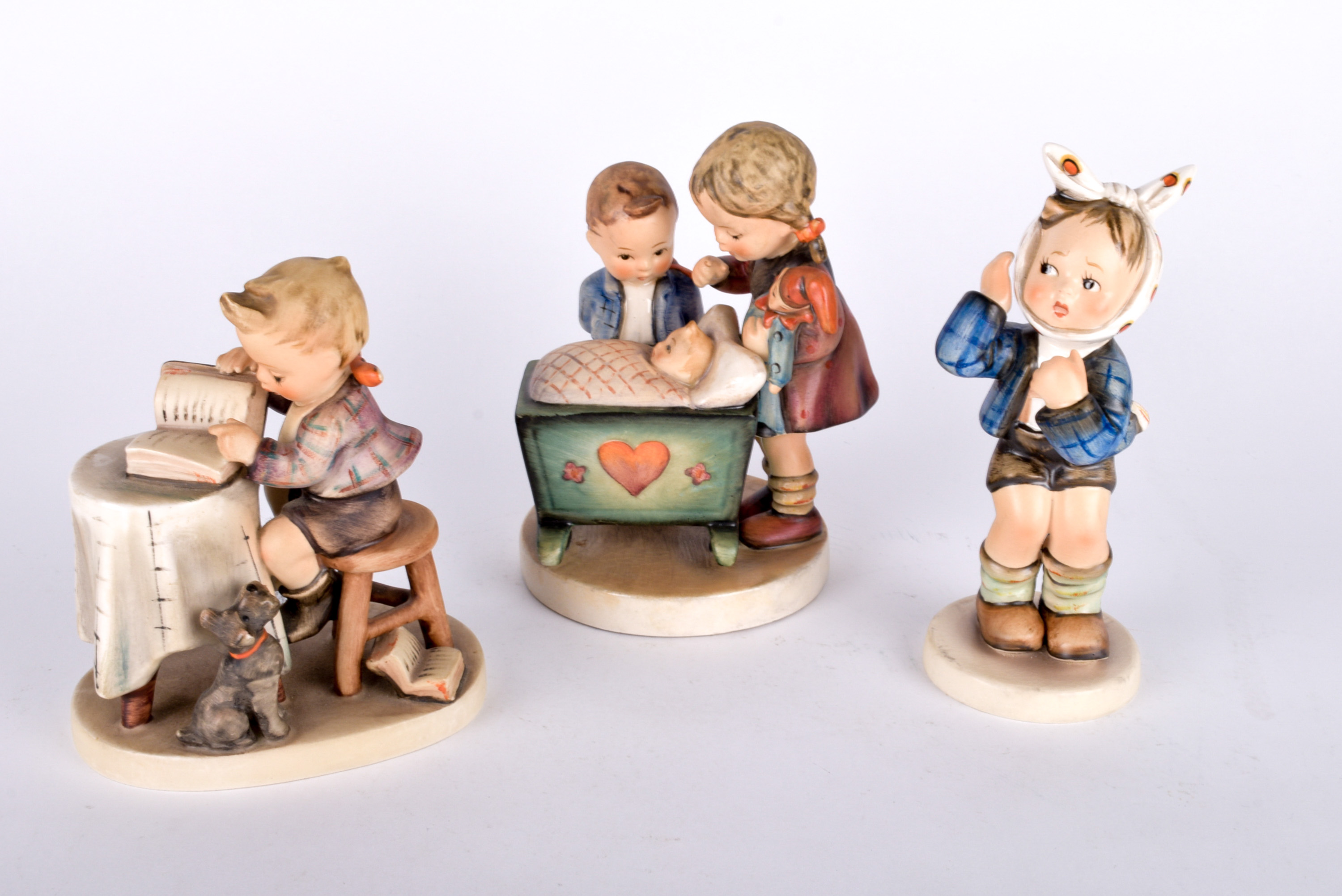 Trio of Hummel Figurines and Vintage Calendars