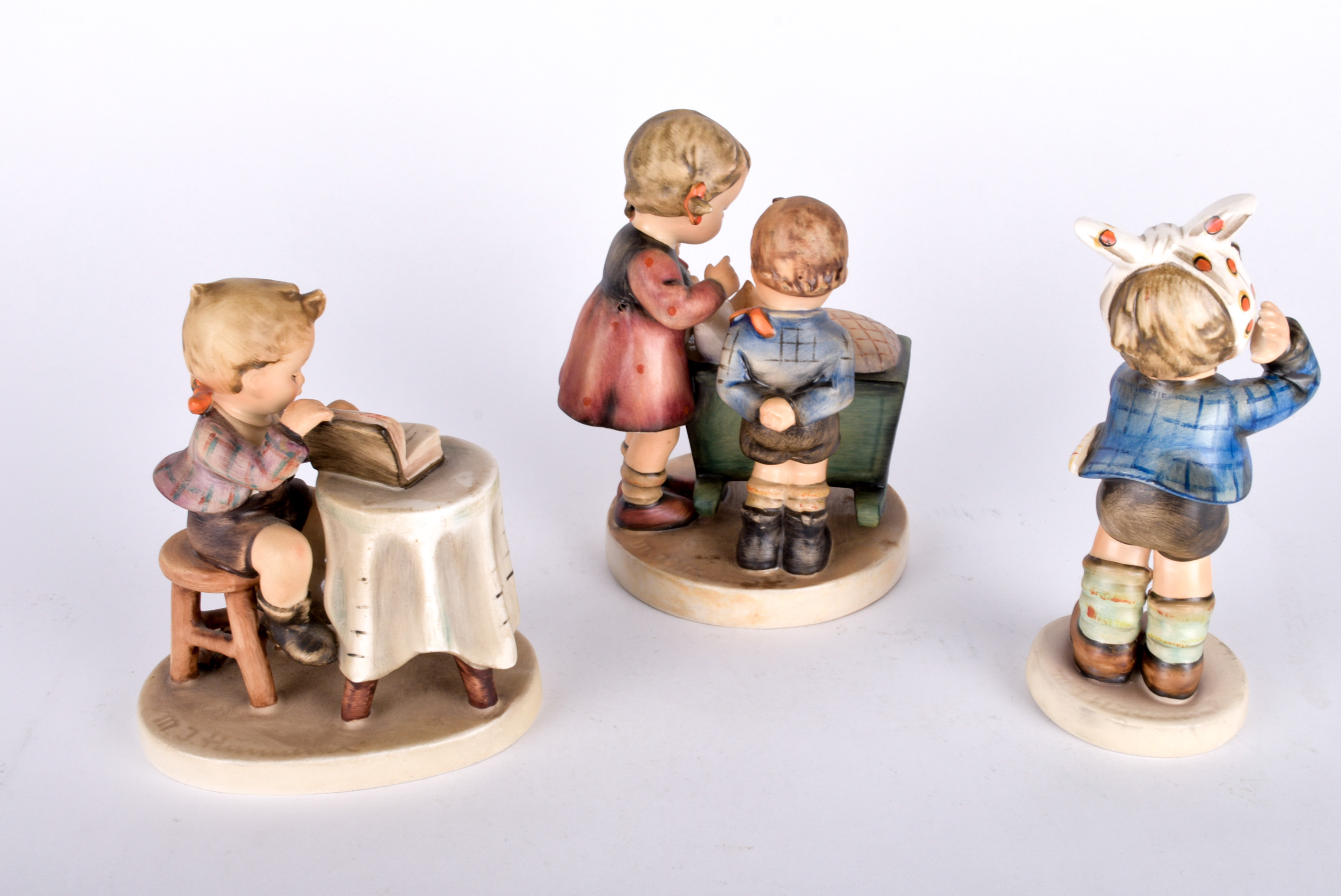 Trio of Hummel Figurines and Vintage Calendars