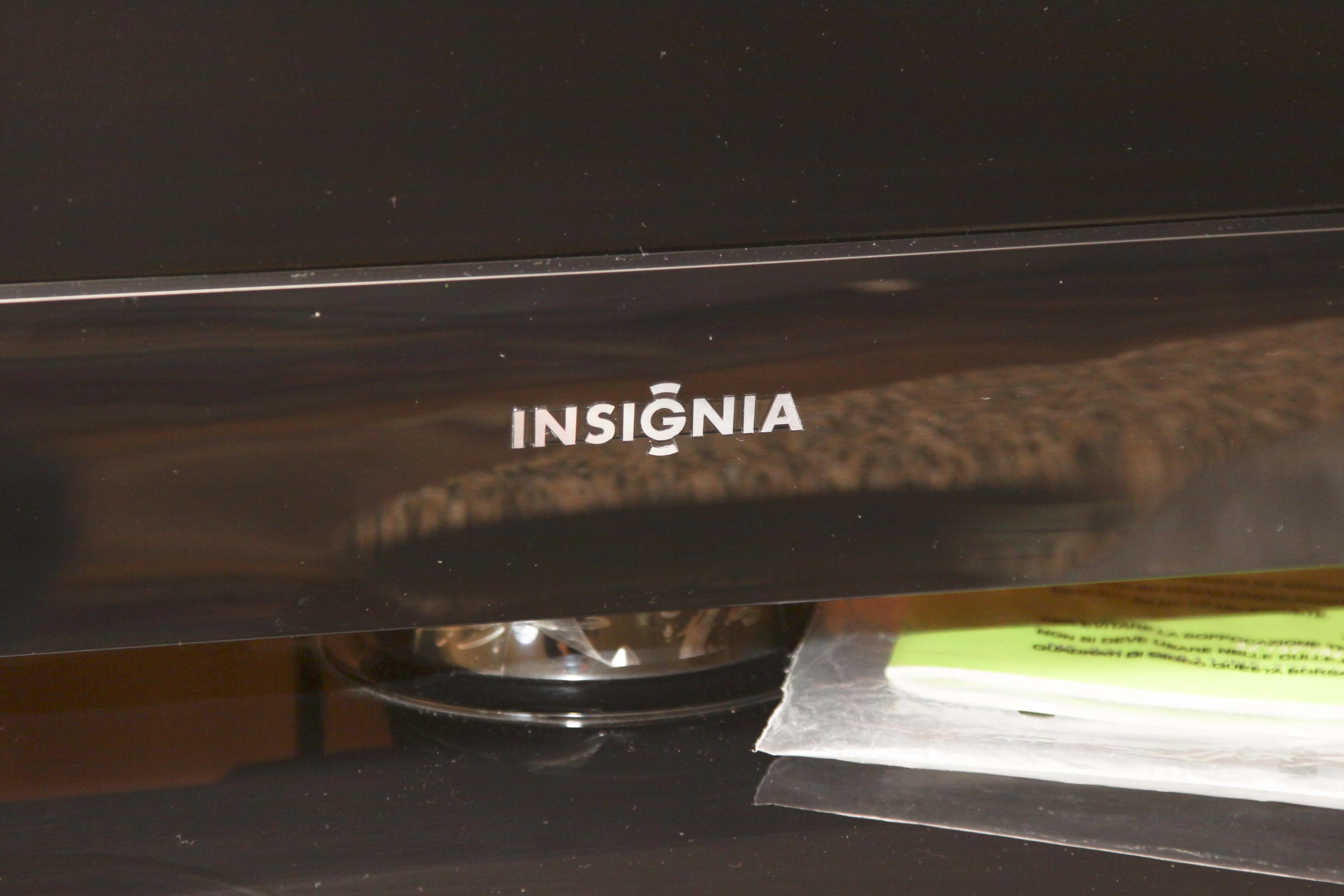 Insignia Flat Screen Television with Sony Blue Ray DVD Player and Collection of DVDs