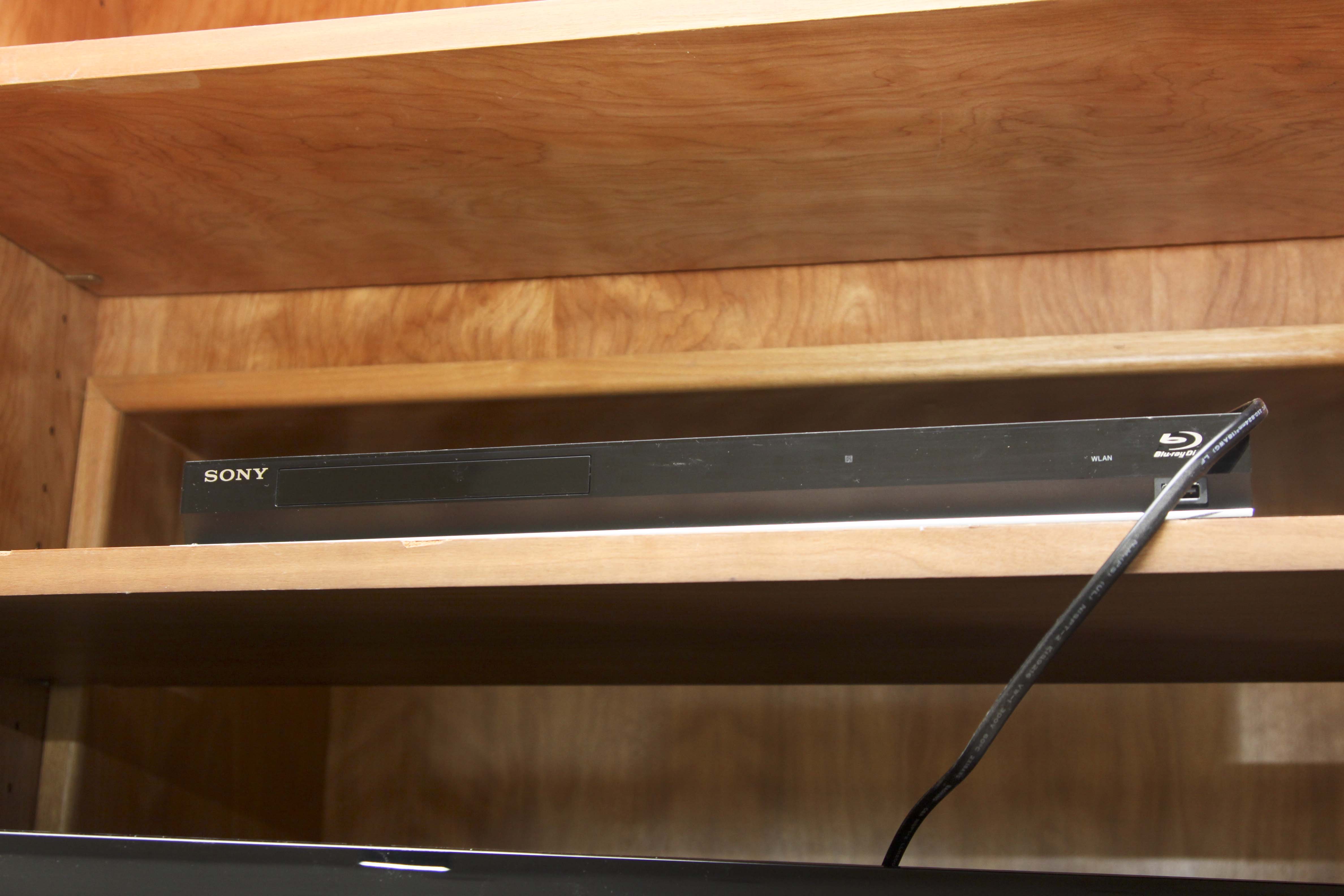 Insignia Flat Screen Television with Sony Blue Ray DVD Player and Collection of DVDs