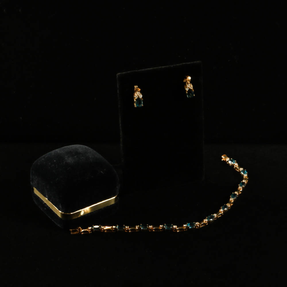 A Gold, Blue Topaz and Diamond Jewelry Ensemble