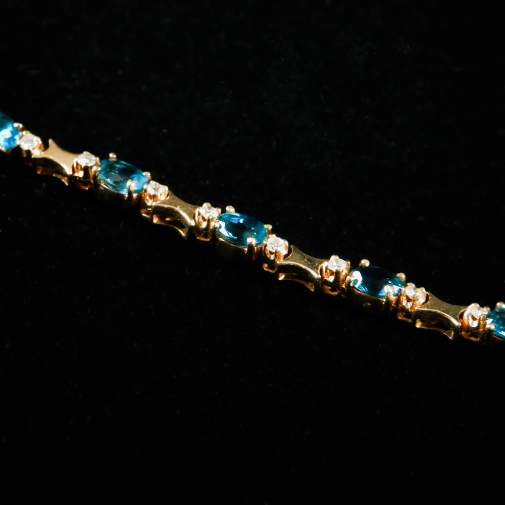 A Gold, Blue Topaz and Diamond Jewelry Ensemble