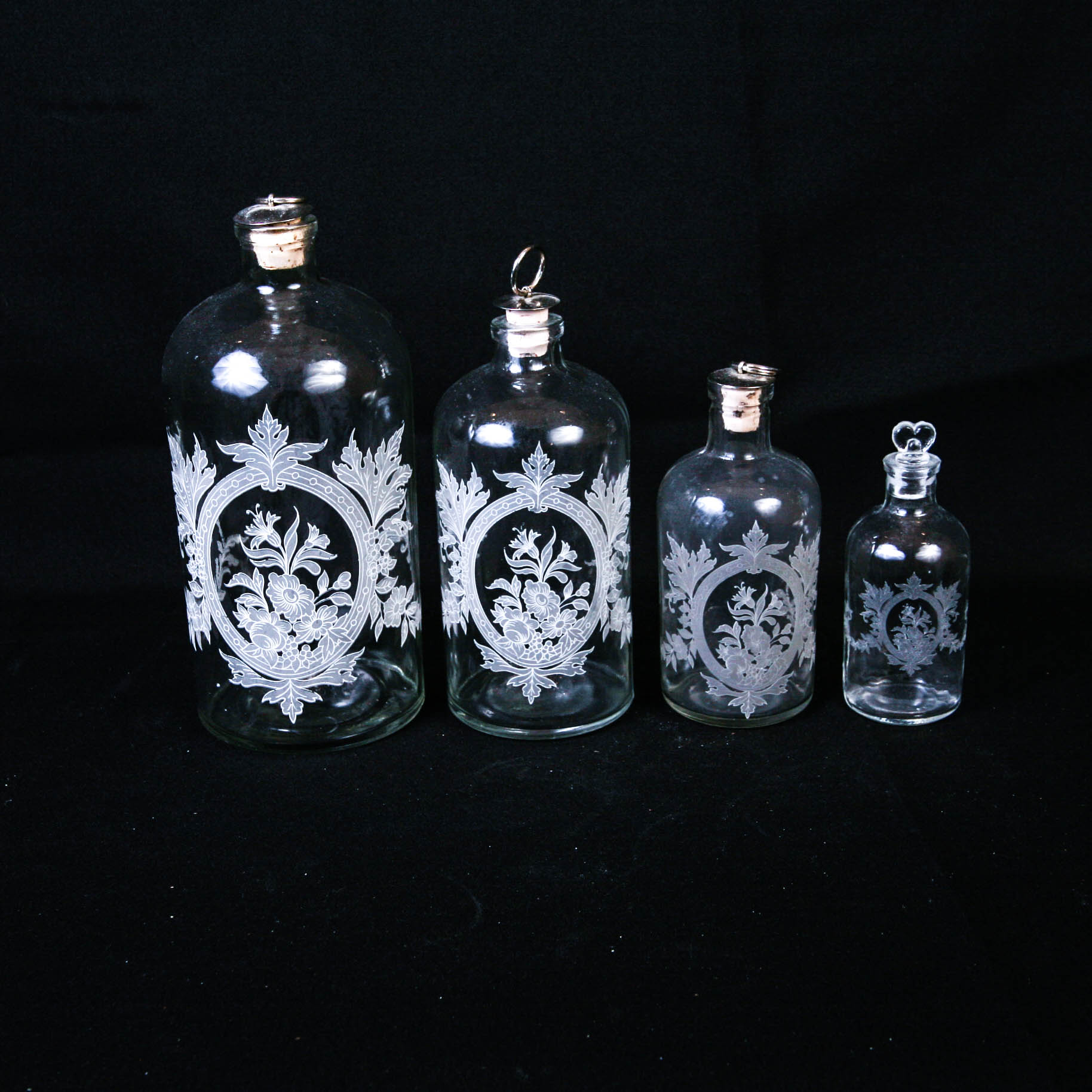 Set of Four Decorative Decanters