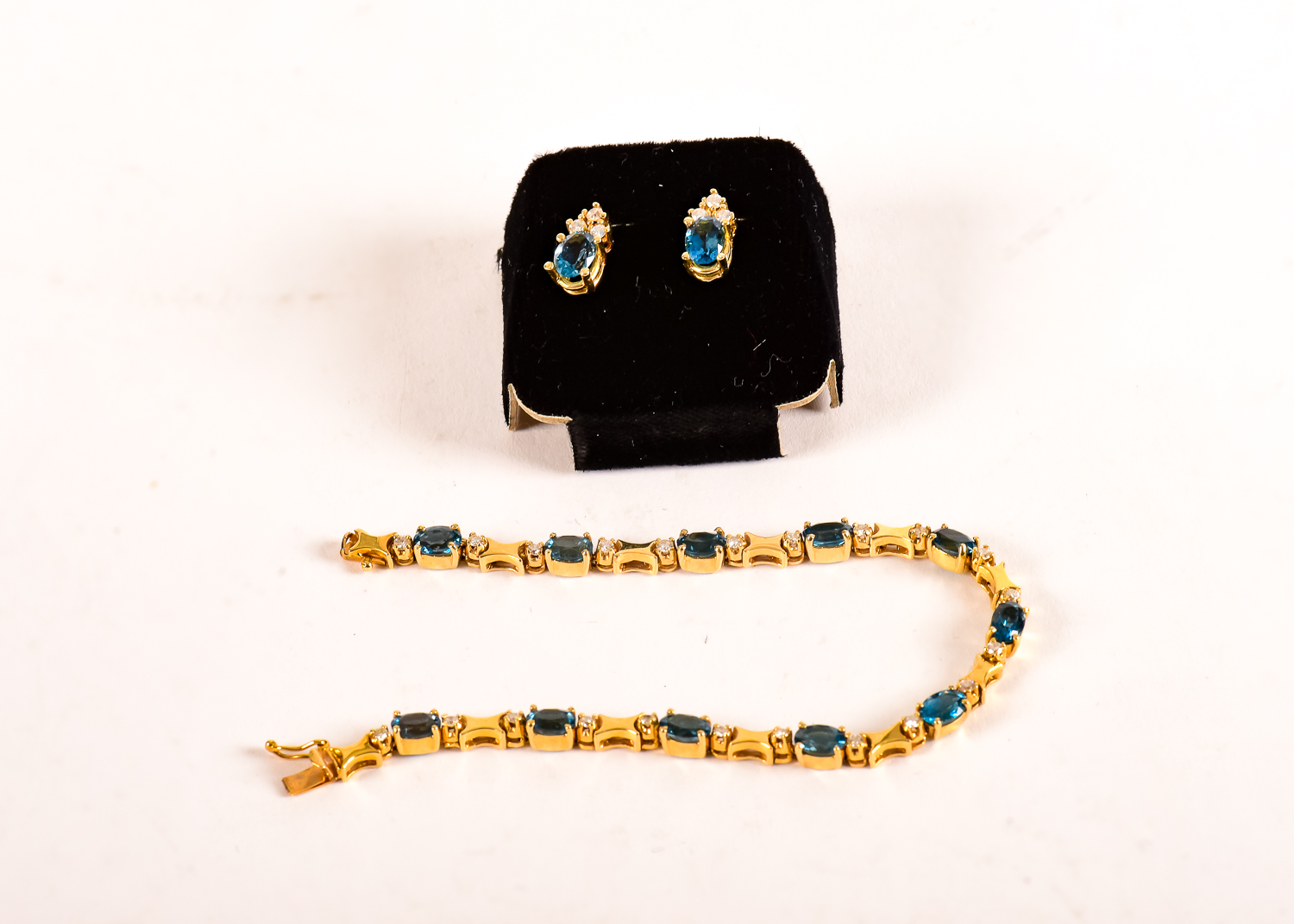 A Gold, Blue Topaz and Diamond Jewelry Ensemble