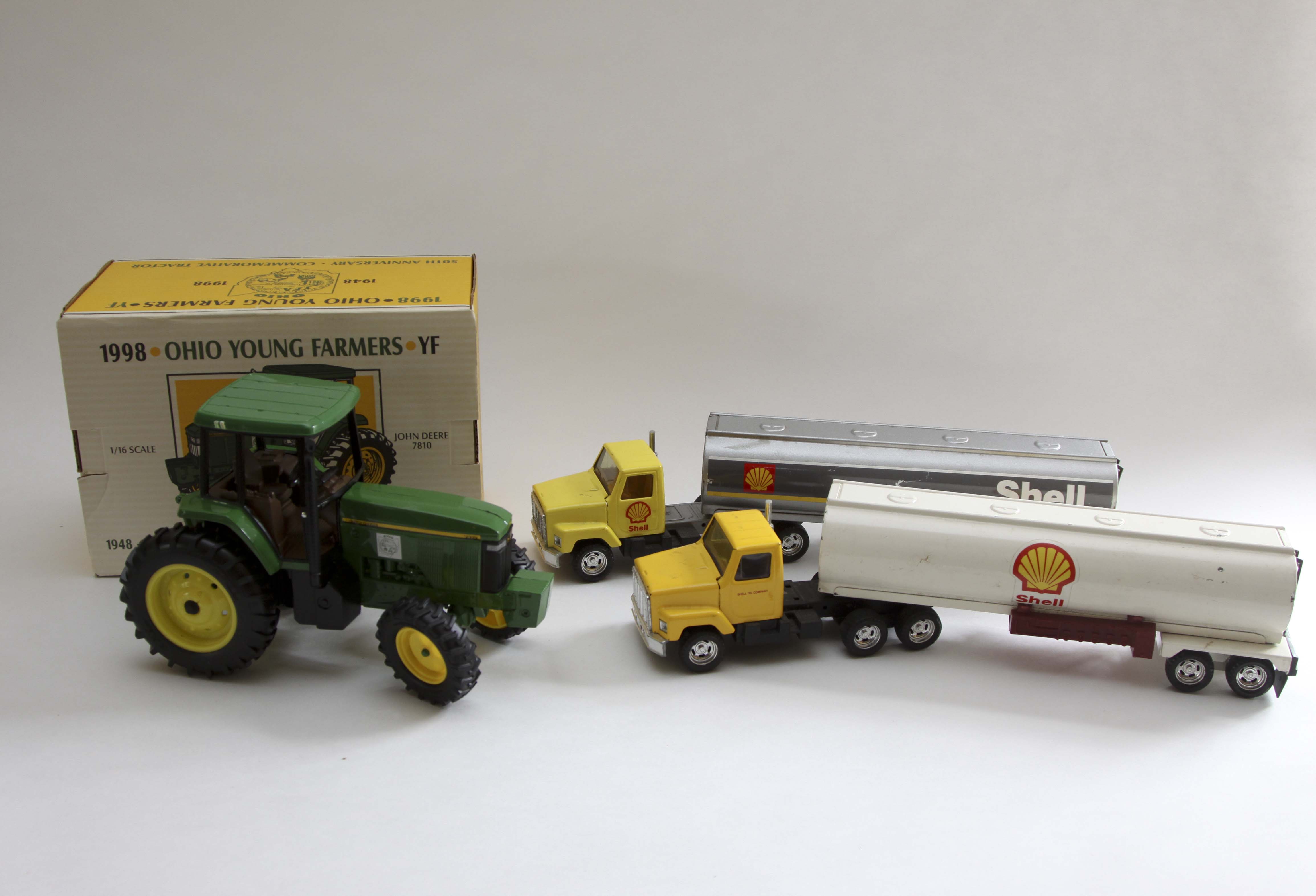 Fiftieth Anniversary John Deere Replica Tractor and Two Vintage Shell Trucks