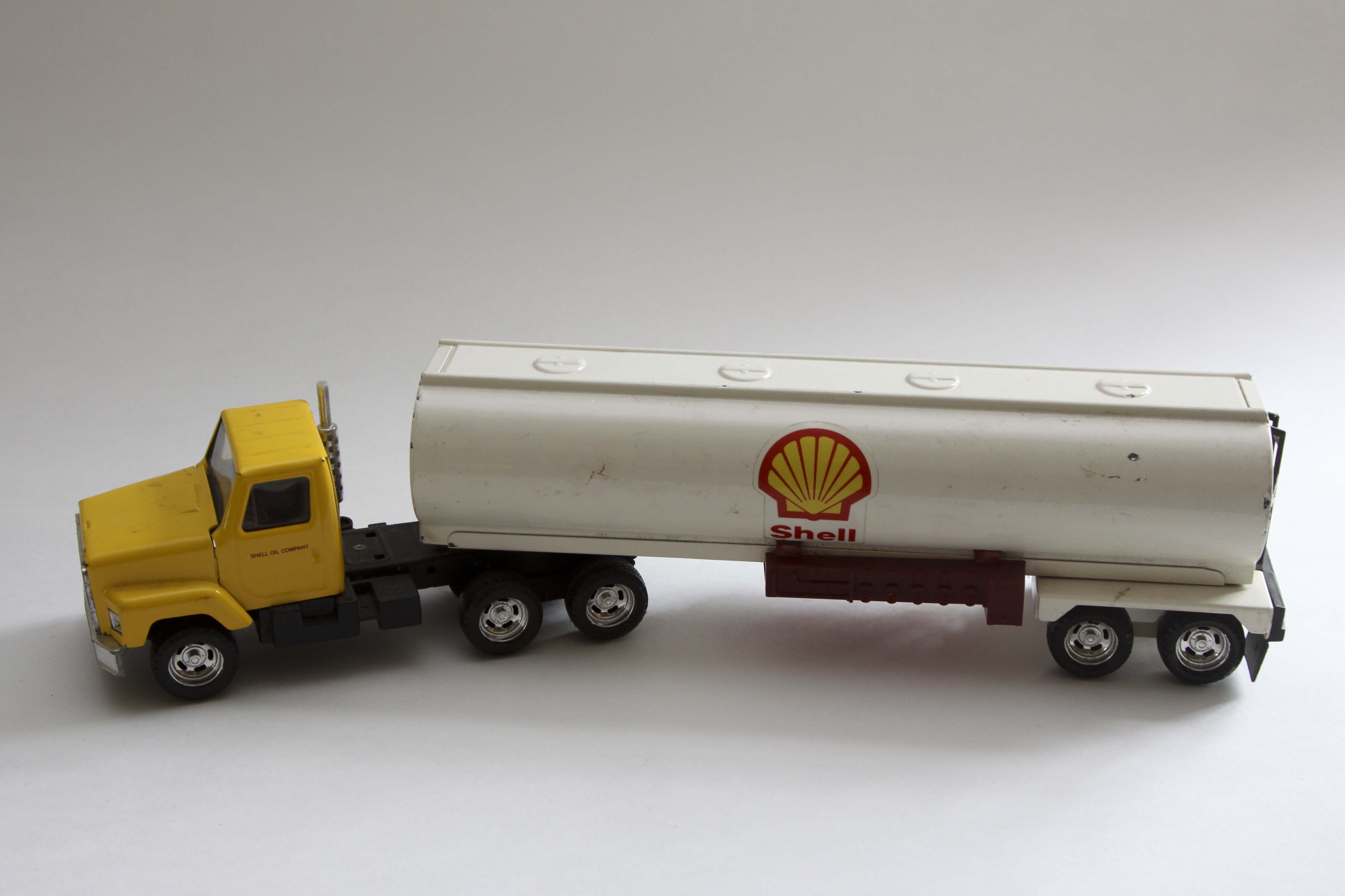 Fiftieth Anniversary John Deere Replica Tractor and Two Vintage Shell Trucks