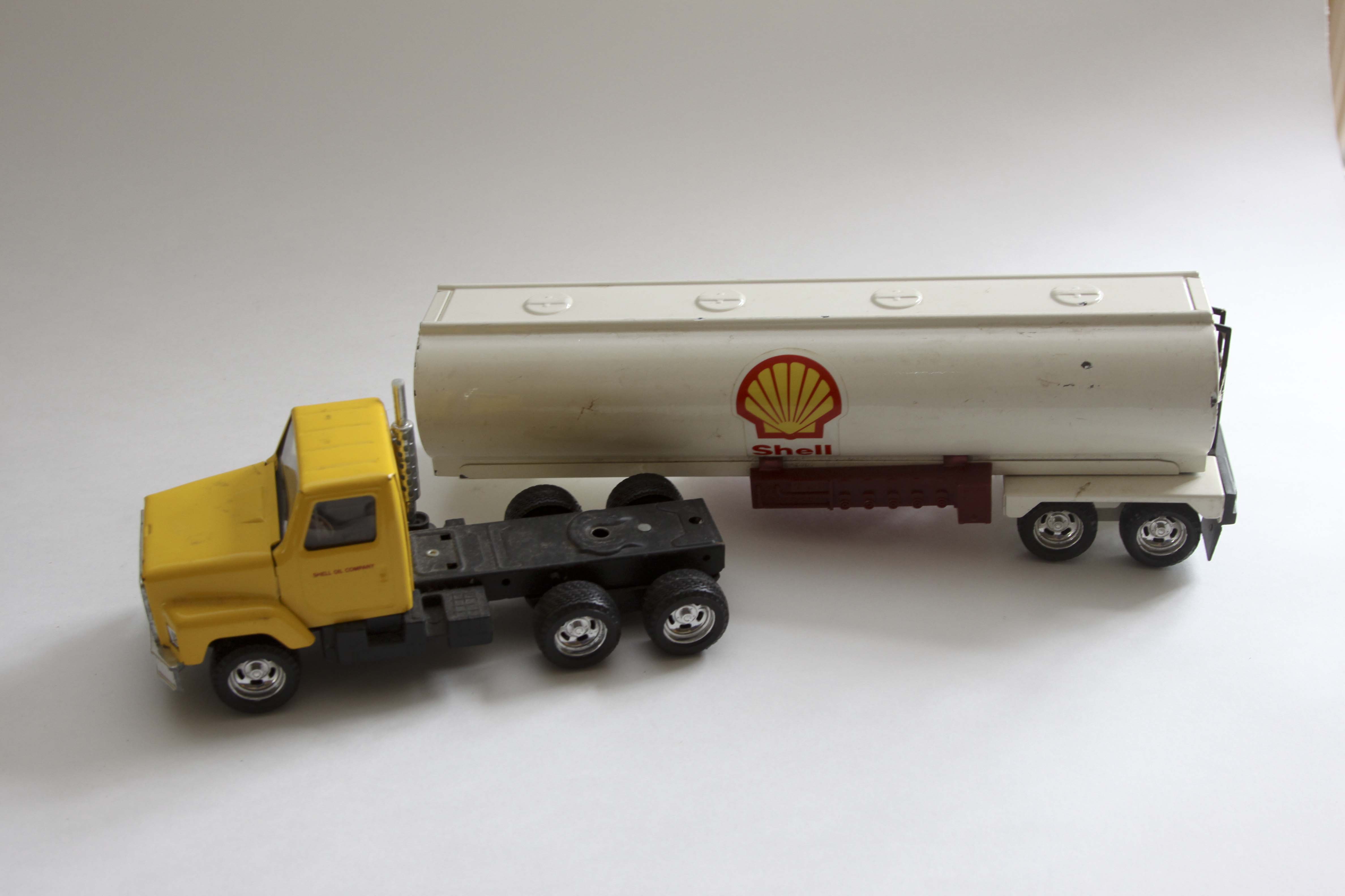 Fiftieth Anniversary John Deere Replica Tractor and Two Vintage Shell Trucks