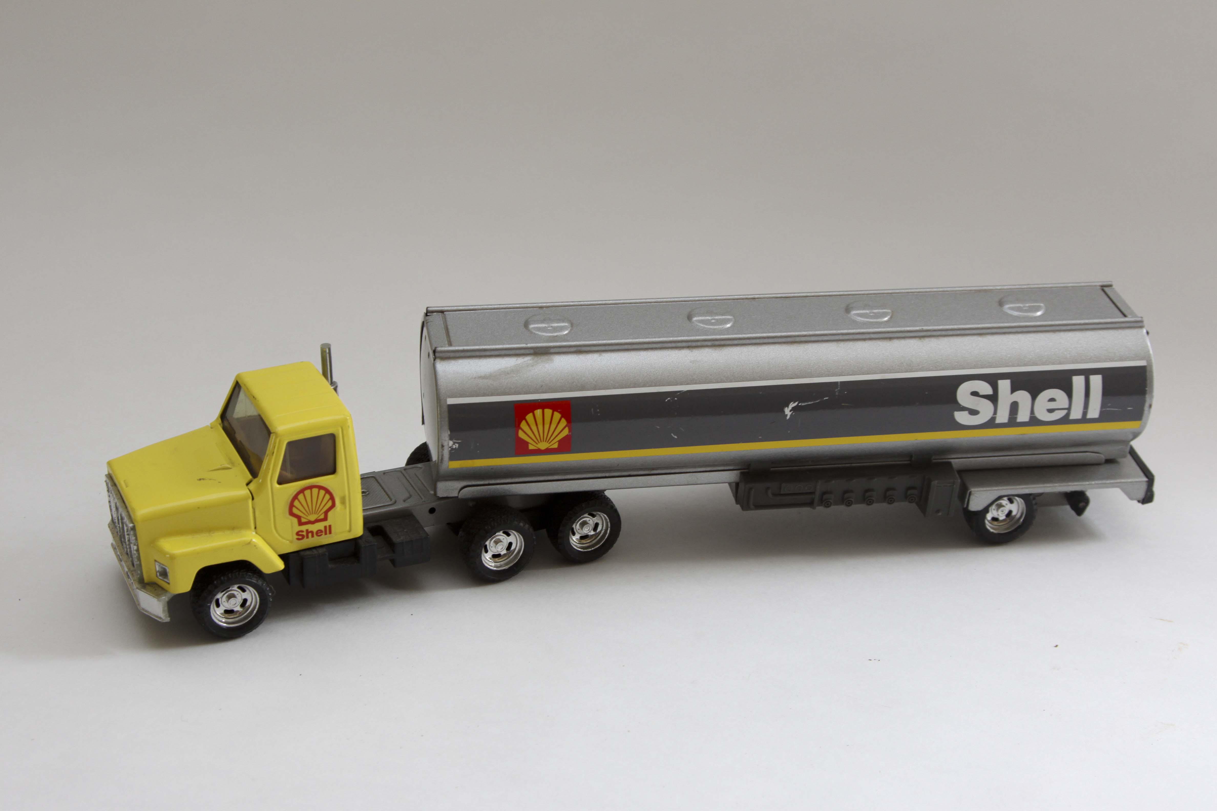 Fiftieth Anniversary John Deere Replica Tractor and Two Vintage Shell Trucks