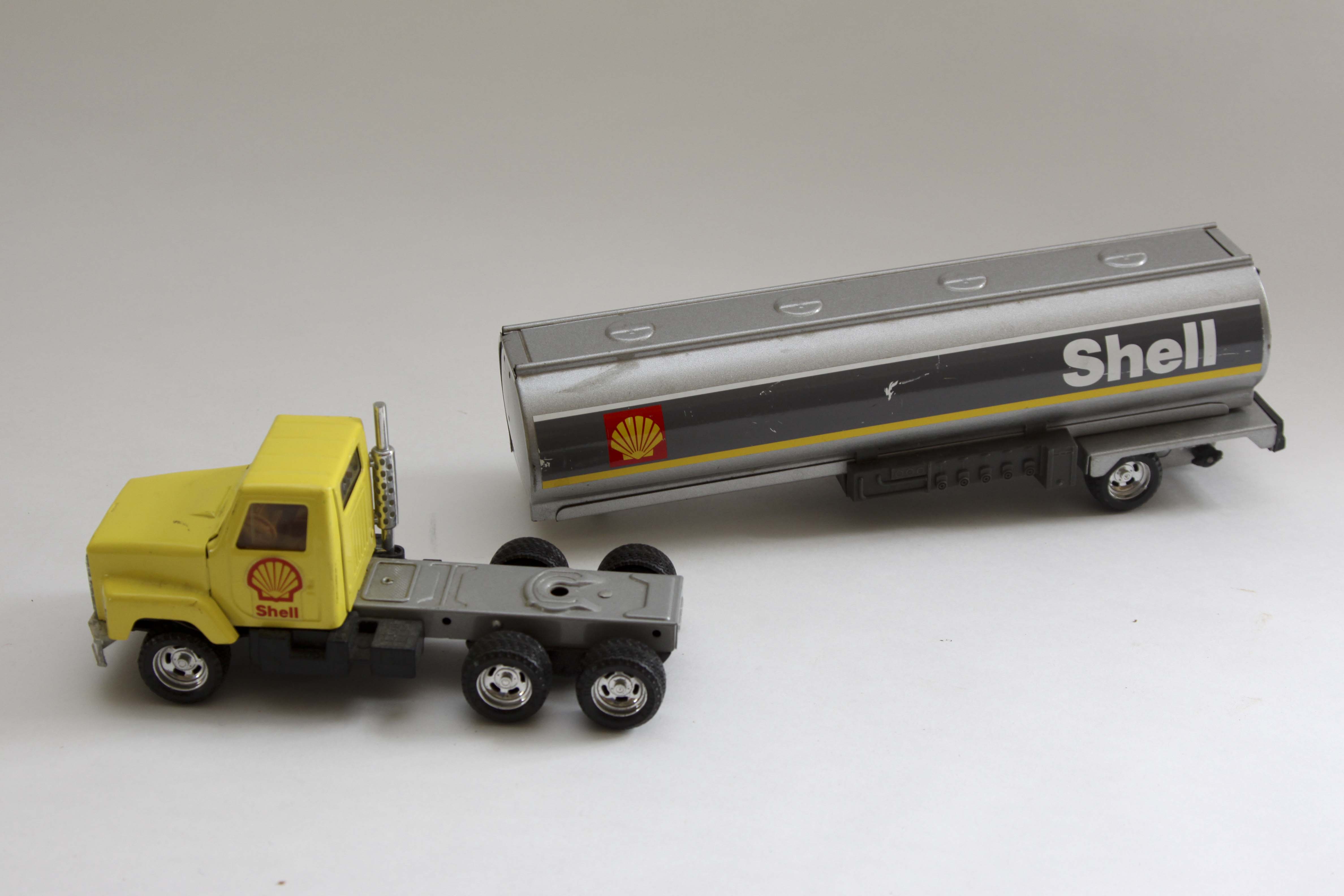 Fiftieth Anniversary John Deere Replica Tractor and Two Vintage Shell Trucks