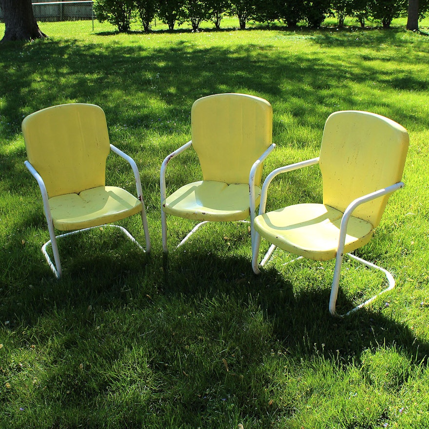 Three Vintage Yellow Metal Patio Chairs