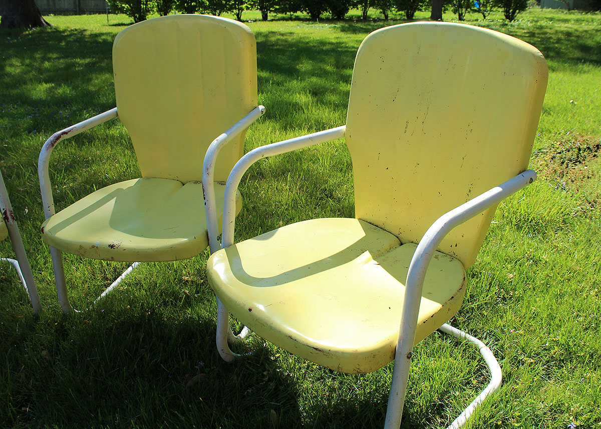 Three Vintage Yellow Metal Patio Chairs