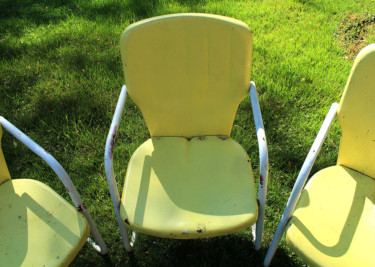 Three Vintage Yellow Metal Patio Chairs