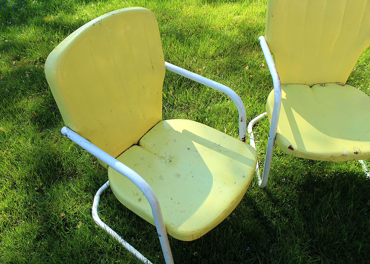 Three Vintage Yellow Metal Patio Chairs