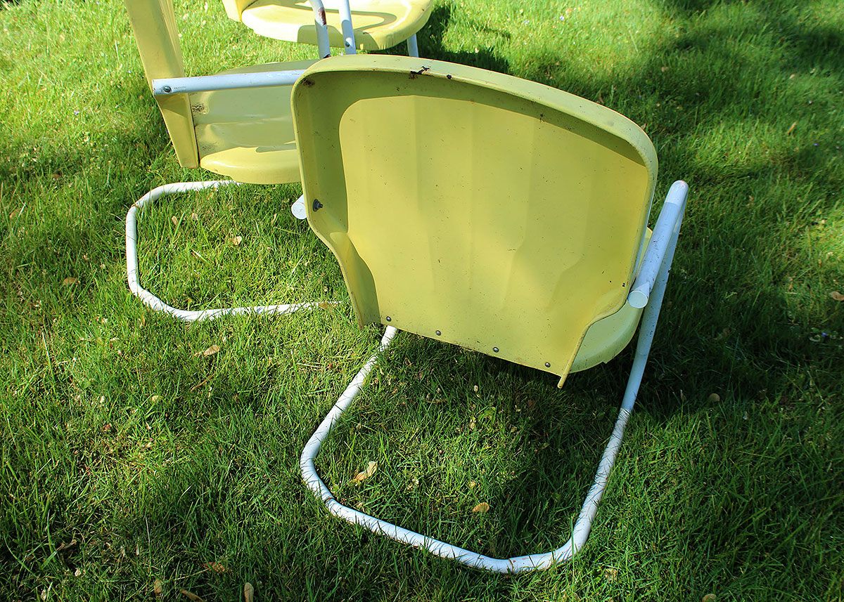 Three Vintage Yellow Metal Patio Chairs