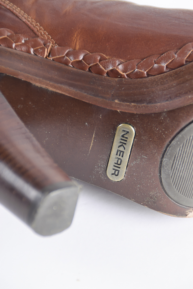 Two Pairs of Nike Air Buckingham G Series Boots