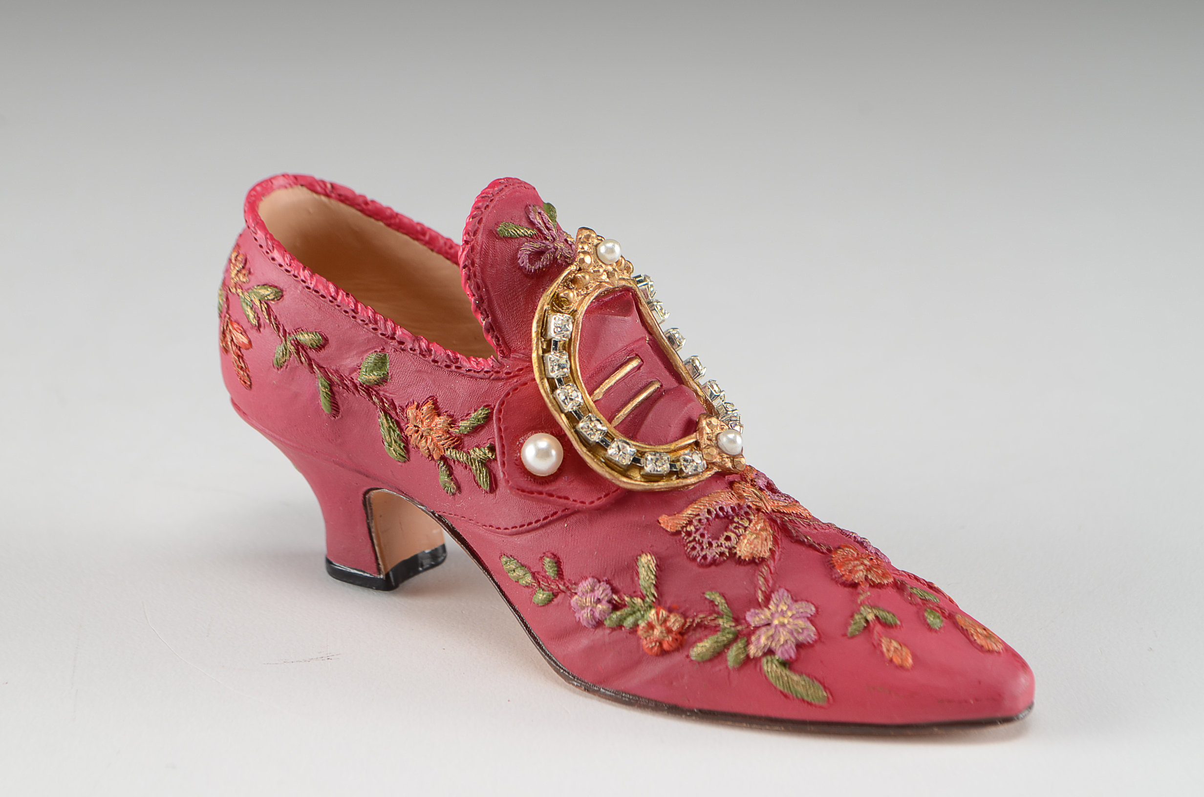 Collection of Four Miniature Resin Shoe Figurines Including Nostalgia