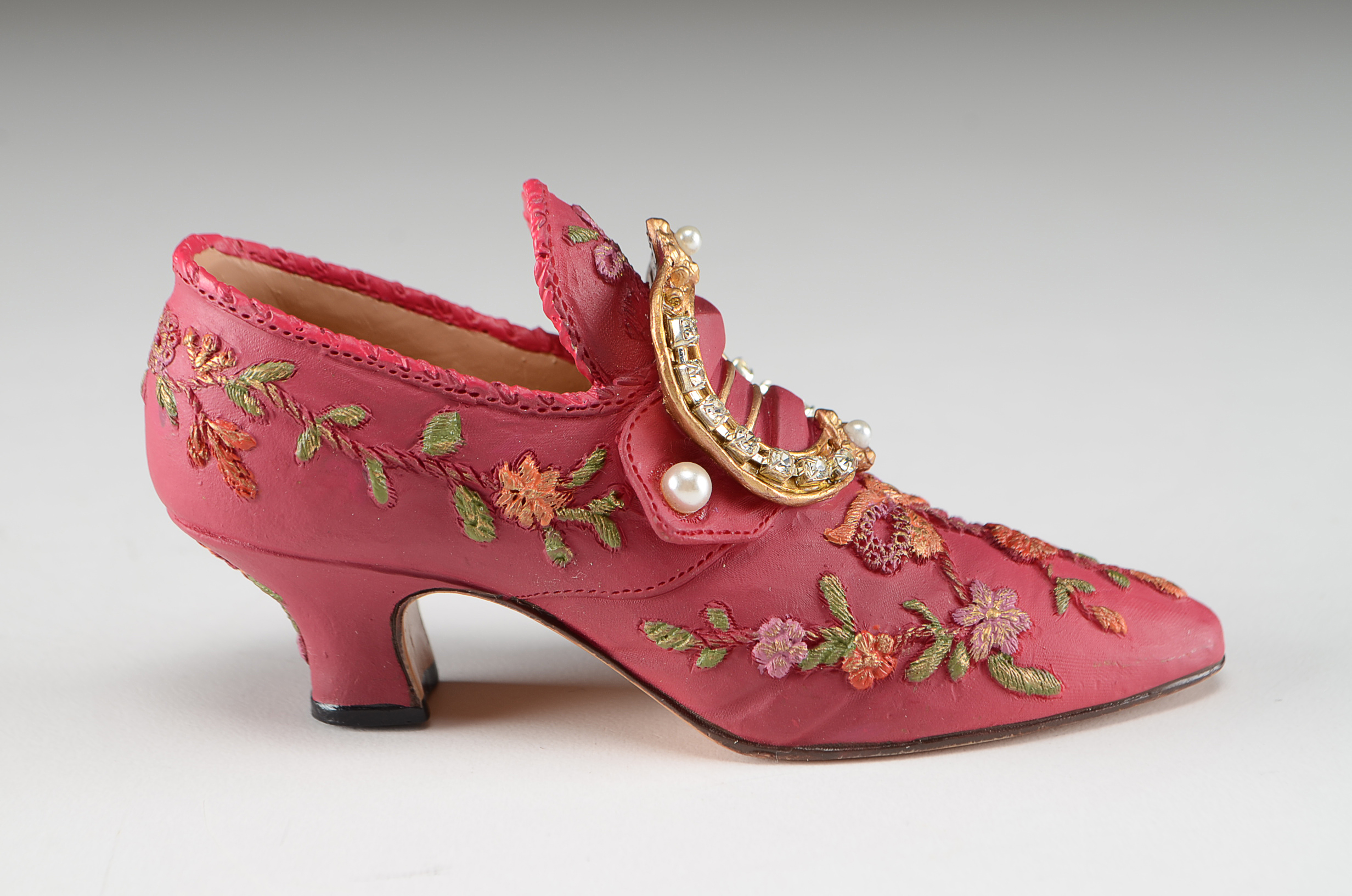 Collection of Four Miniature Resin Shoe Figurines Including Nostalgia