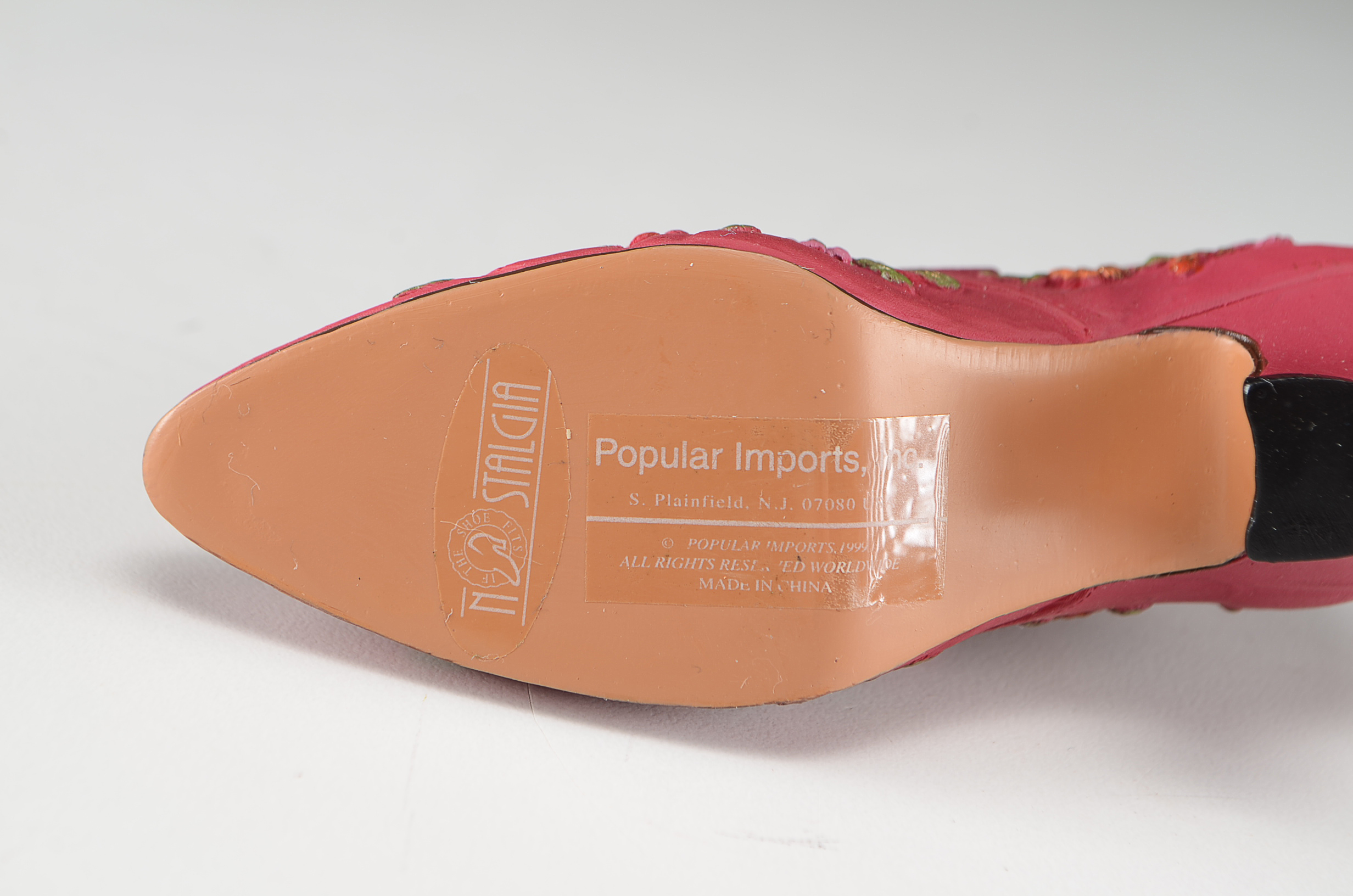 Collection of Four Miniature Resin Shoe Figurines Including Nostalgia