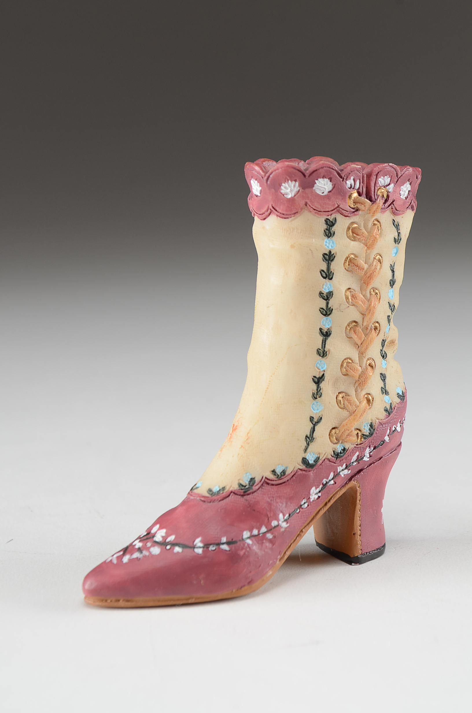 Collection of Four Miniature Resin Shoe Figurines Including Nostalgia