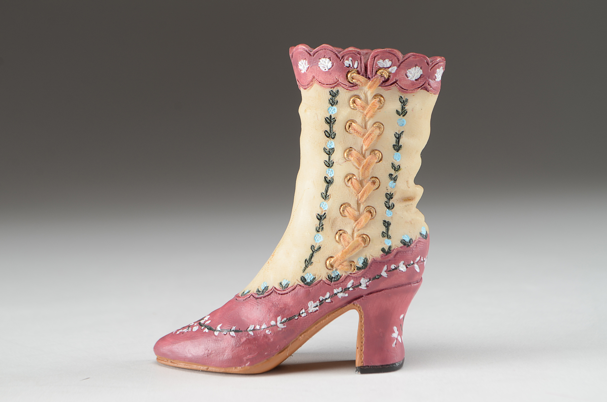 Collection of Four Miniature Resin Shoe Figurines Including Nostalgia