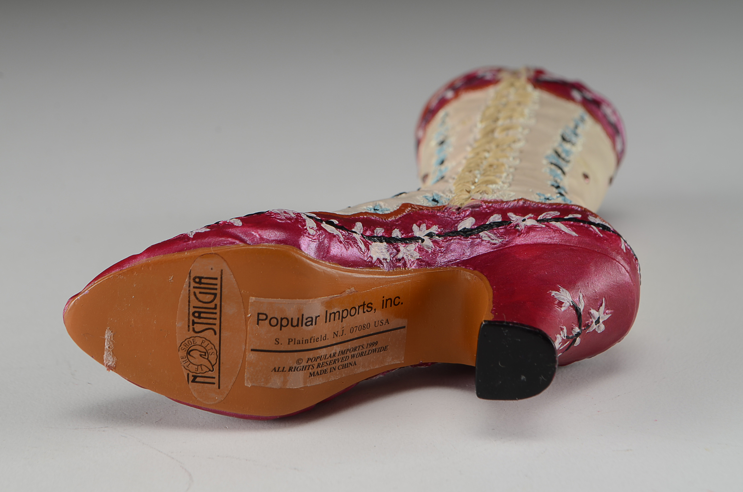 Collection of Four Miniature Resin Shoe Figurines Including Nostalgia