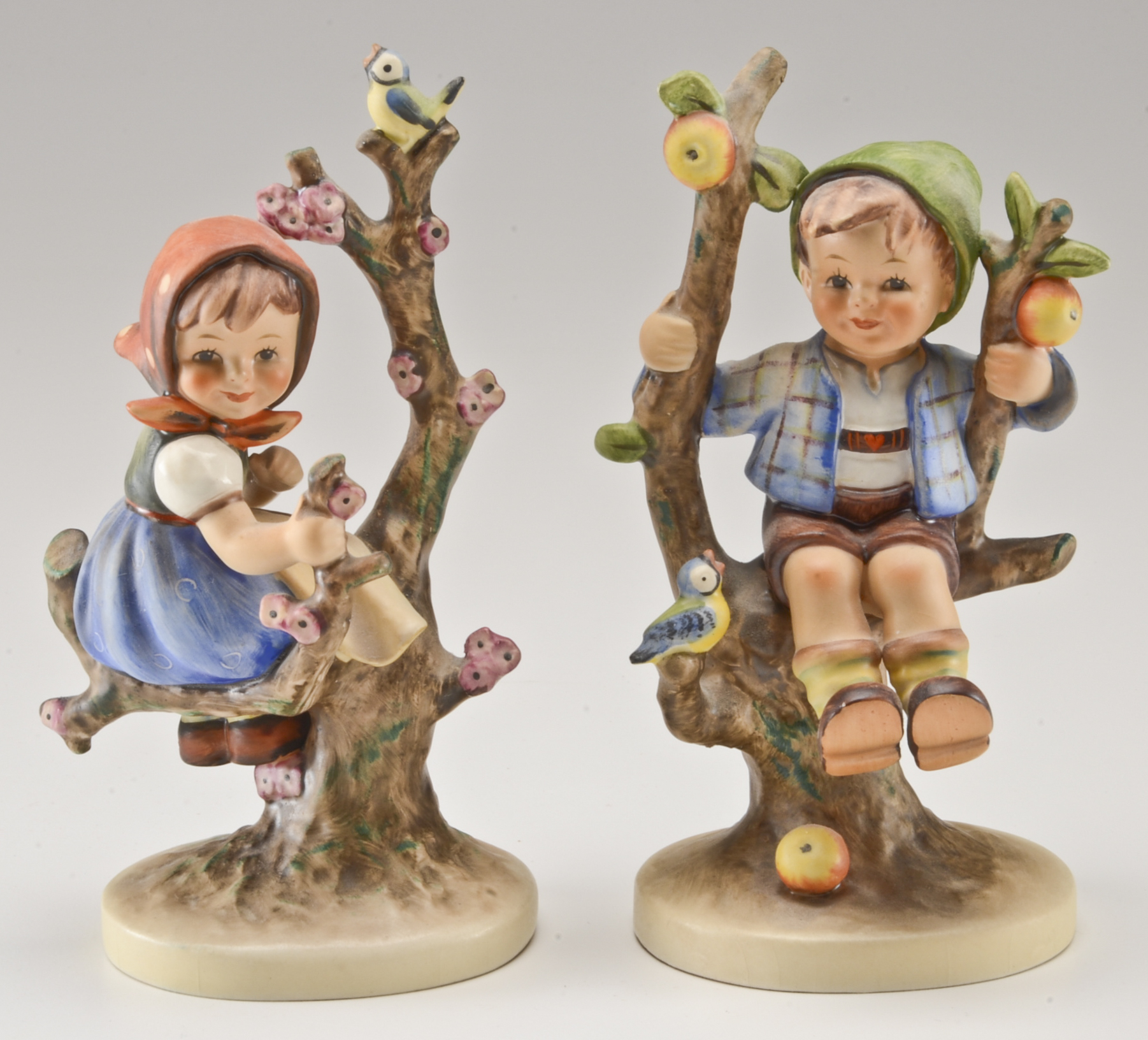 Hummel "Apple Tree Boy" and "Apple Tree Girl" Figurines
