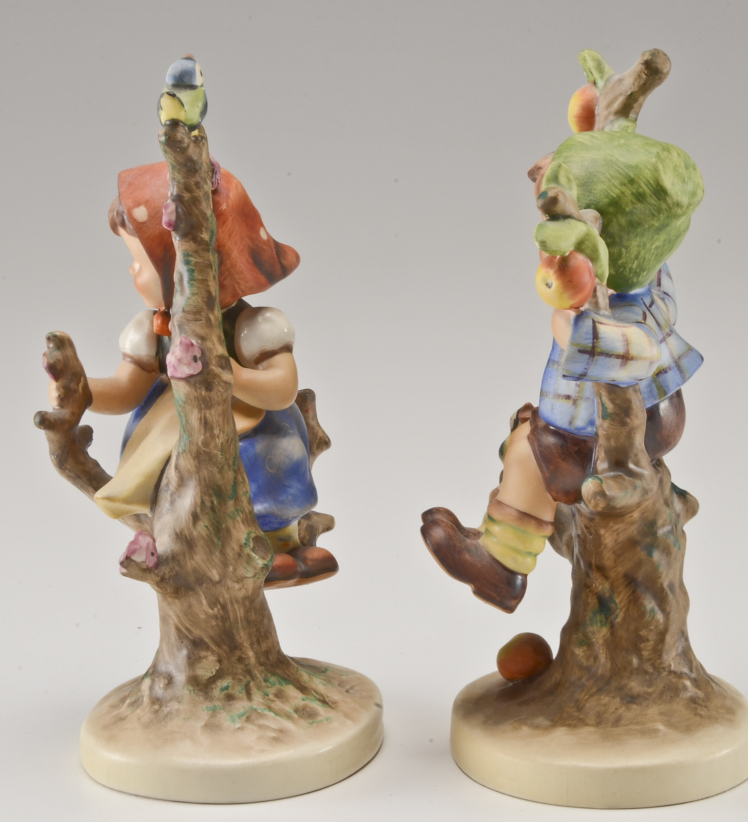 Hummel "Apple Tree Boy" and "Apple Tree Girl" Figurines