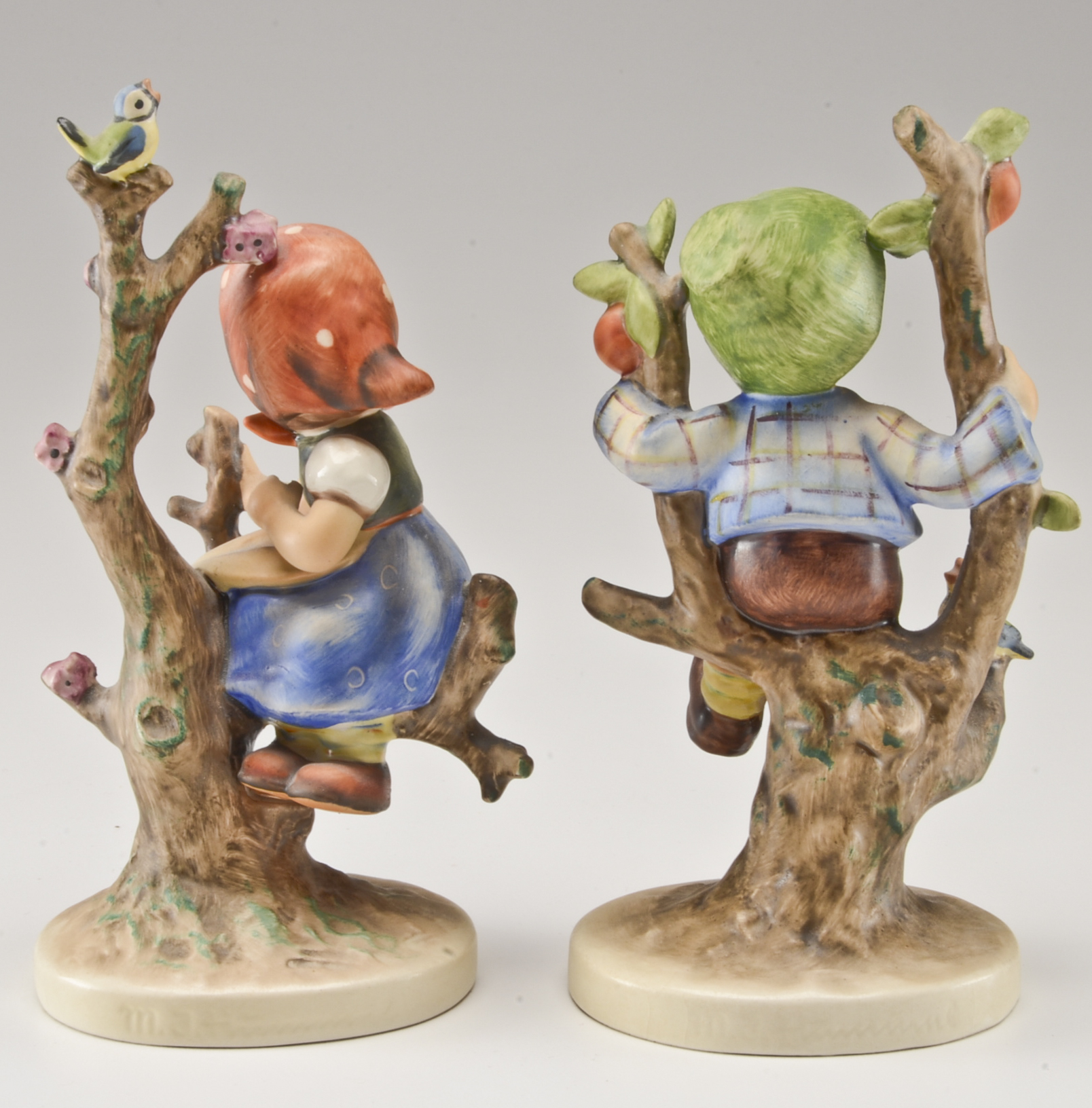Hummel "Apple Tree Boy" and "Apple Tree Girl" Figurines