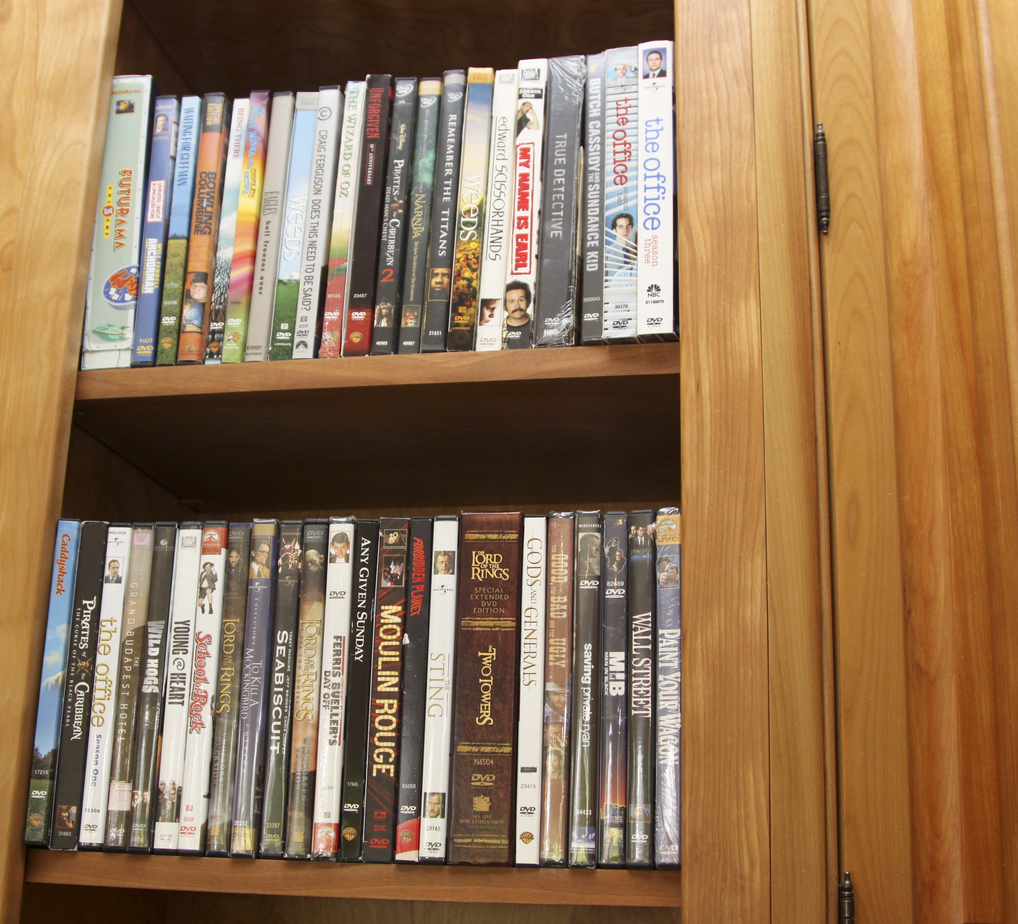 Insignia Flat Screen Television with Sony Blue Ray DVD Player and Collection of DVDs