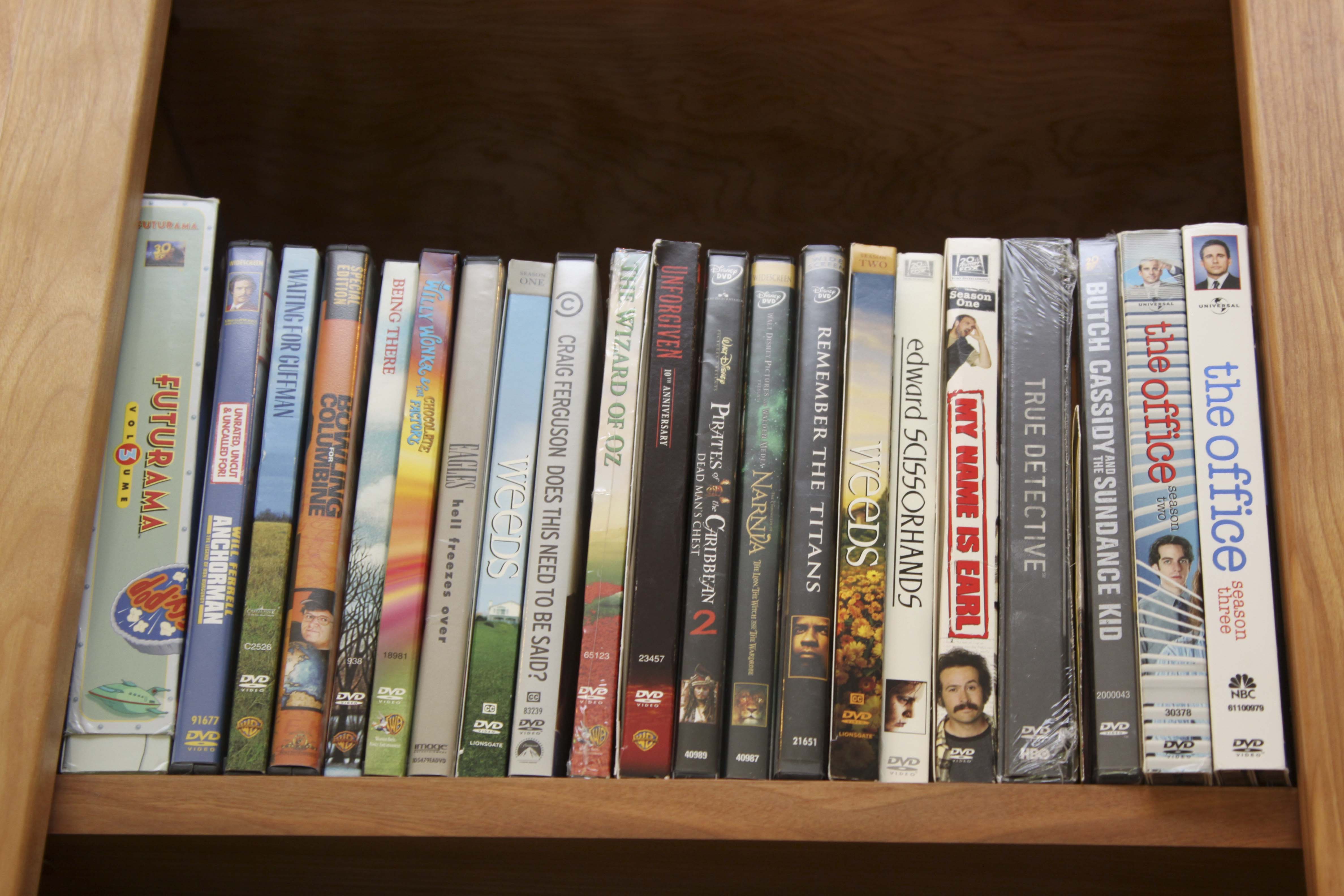 Insignia Flat Screen Television with Sony Blue Ray DVD Player and Collection of DVDs