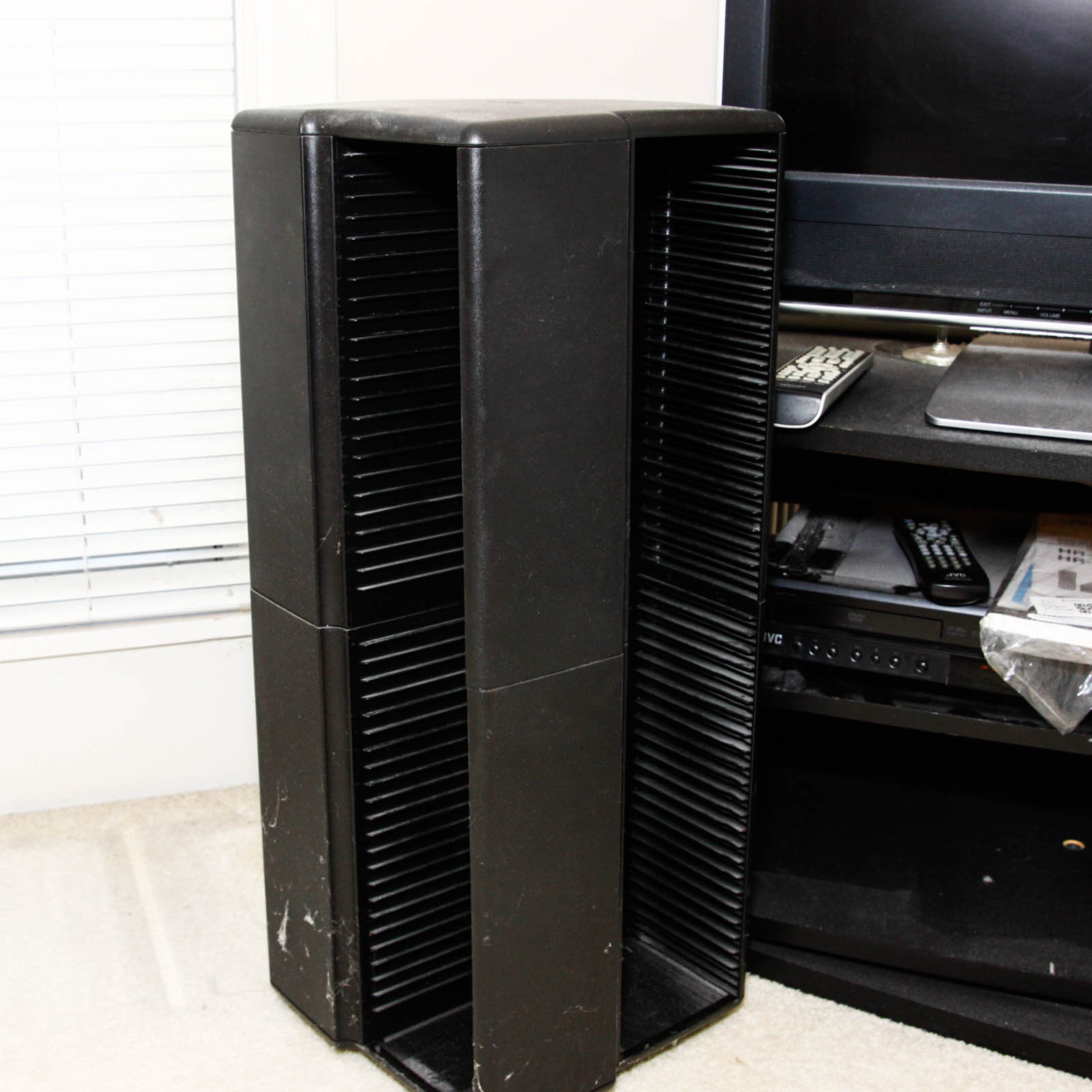 Toshiba Flat Screen Television Mounted on Black Two Shelf Cabinet