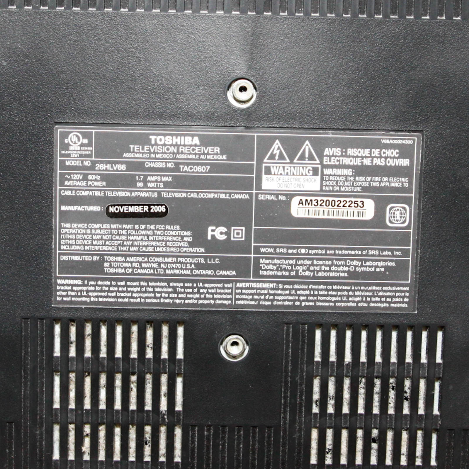 Toshiba Flat Screen Television Mounted on Black Two Shelf Cabinet