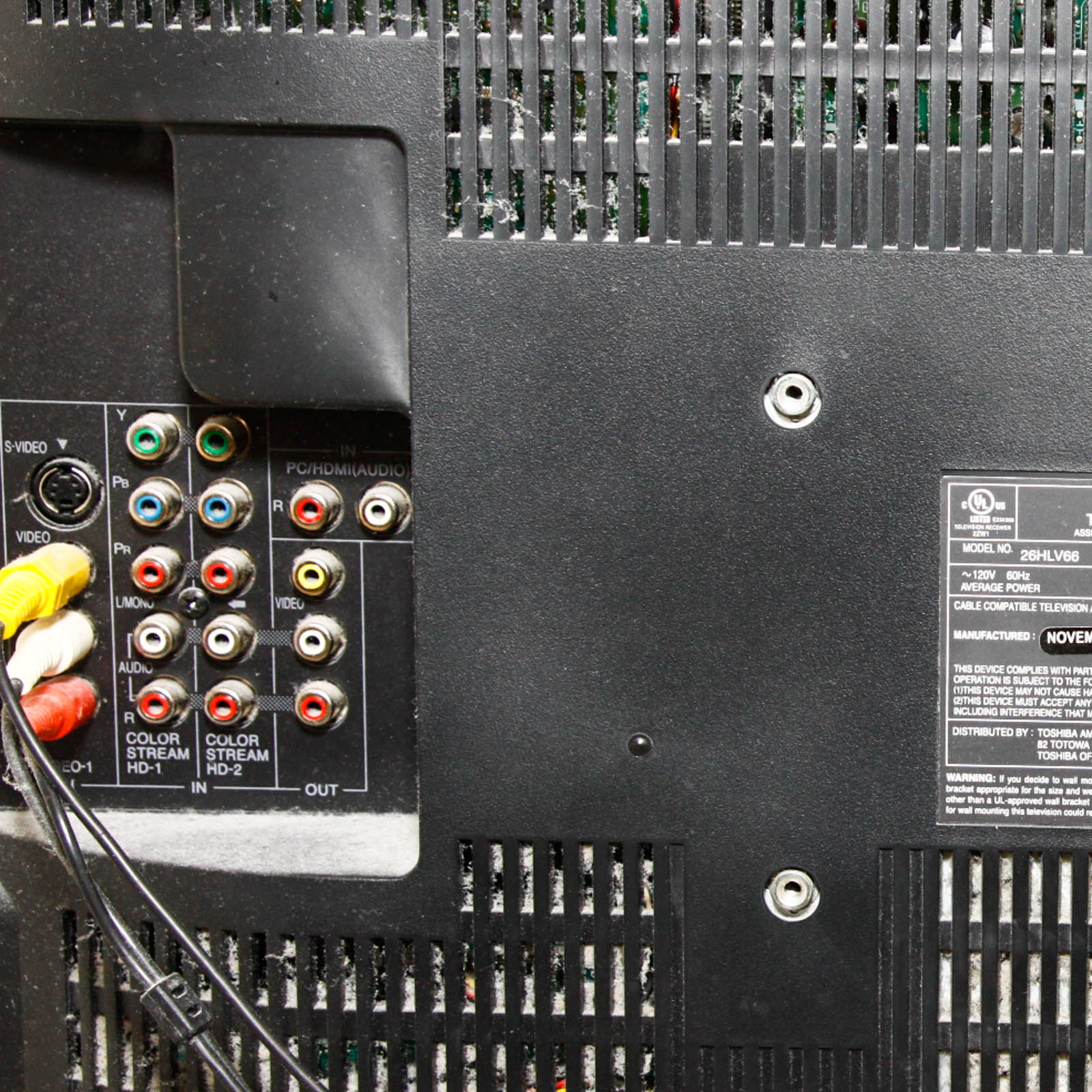 Toshiba Flat Screen Television Mounted on Black Two Shelf Cabinet