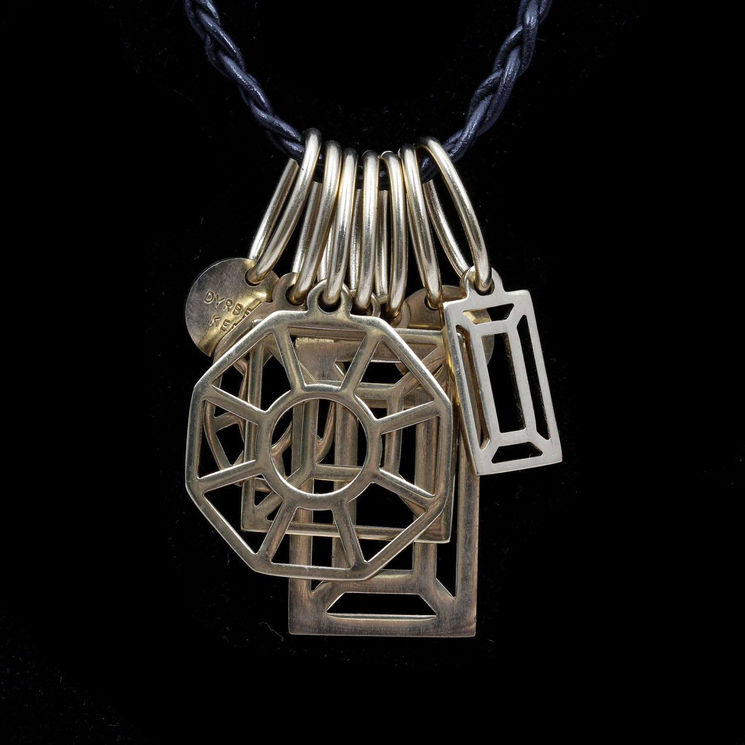 Dyrberg Kern Seven Charm Statement Necklace on Braided Leather Chain