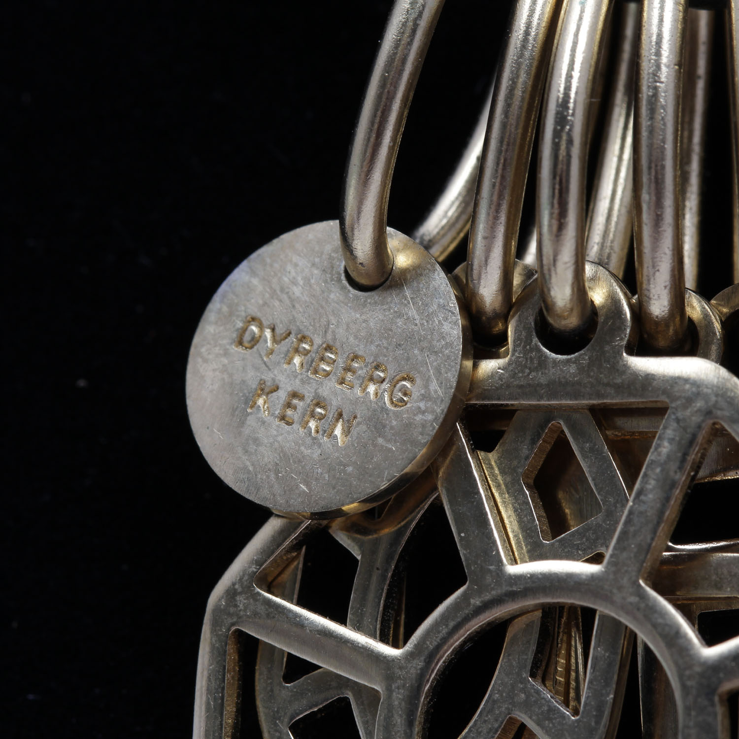 Dyrberg Kern Seven Charm Statement Necklace on Braided Leather Chain