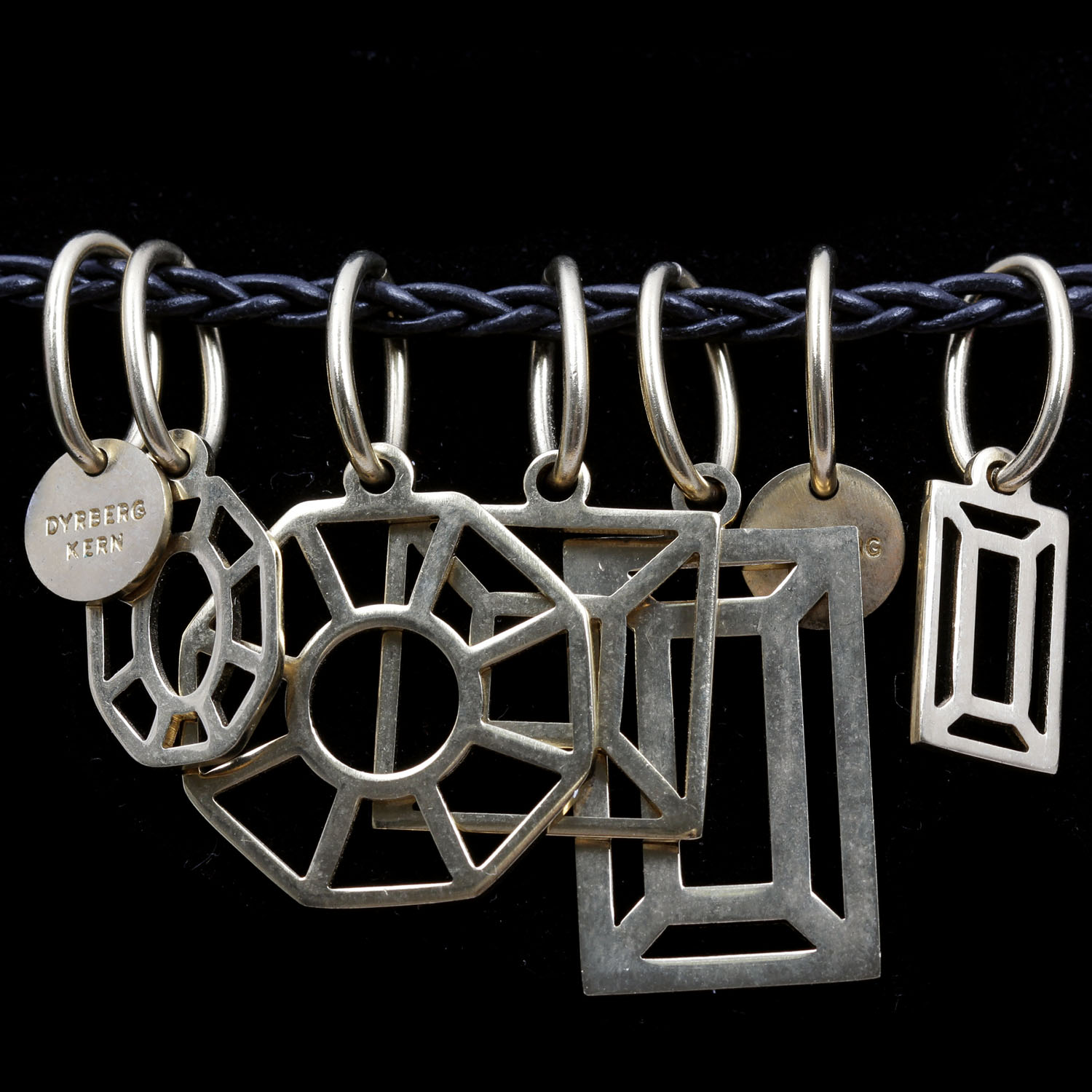 Dyrberg Kern Seven Charm Statement Necklace on Braided Leather Chain