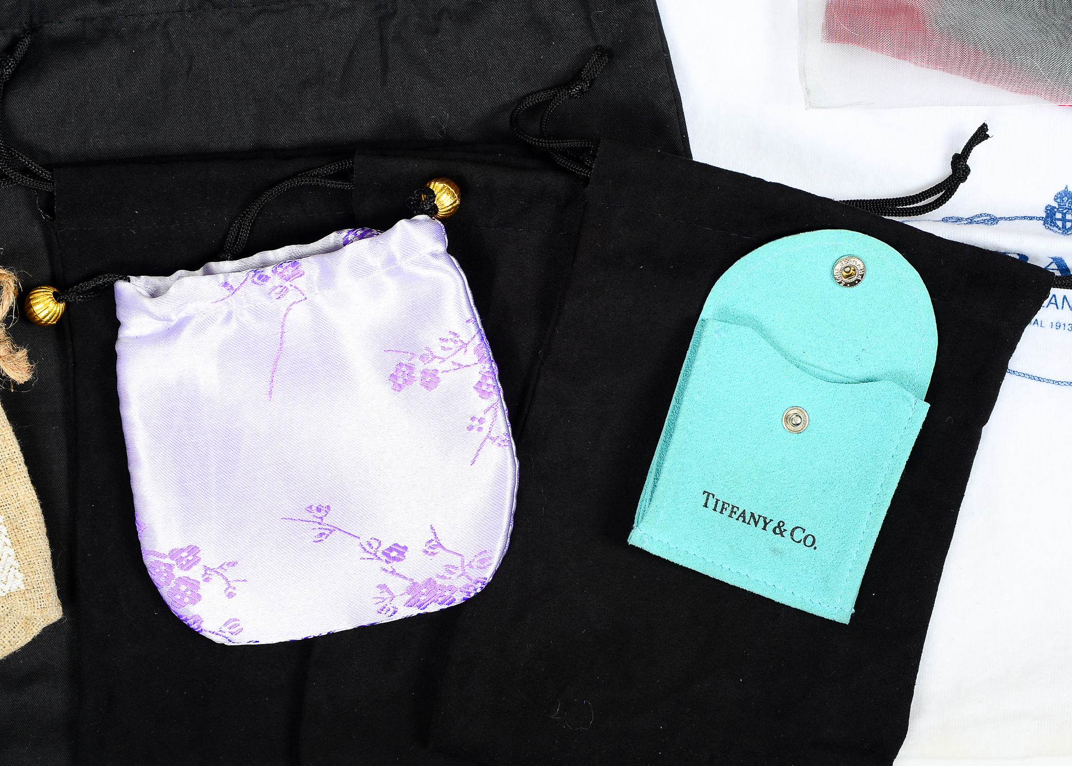 Collection of Dust Bags Featuring Prada, Chanel, Gucci, and More