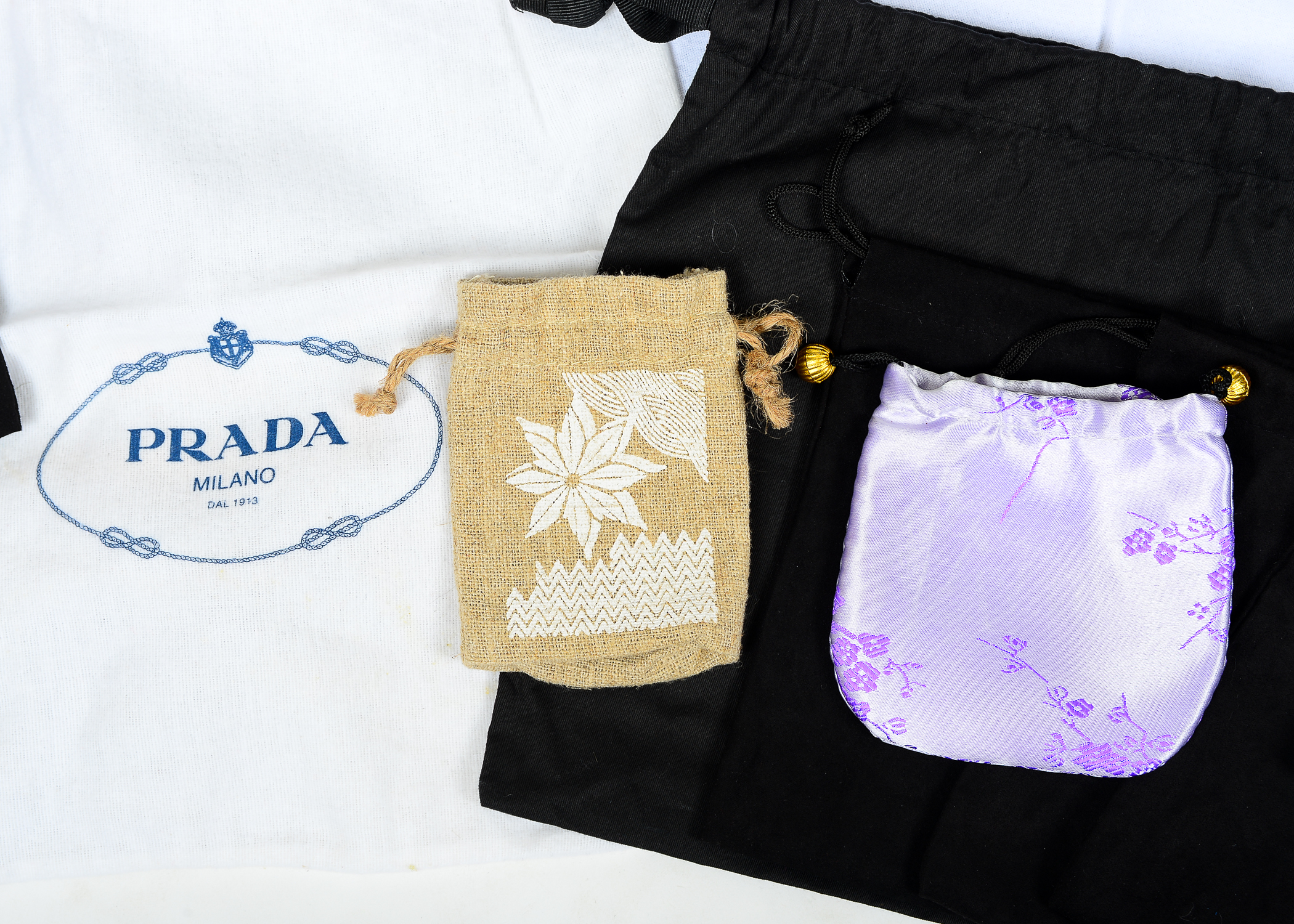 Collection of Dust Bags Featuring Prada, Chanel, Gucci, and More