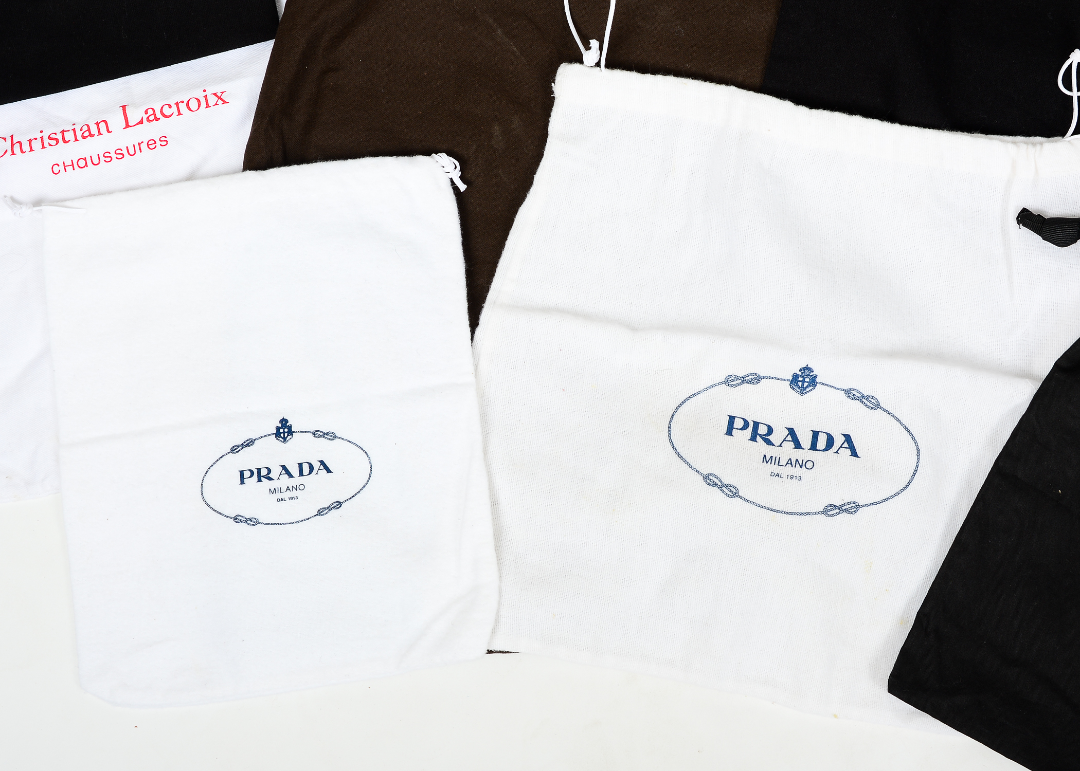 Collection of Dust Bags Featuring Prada, Chanel, Gucci, and More