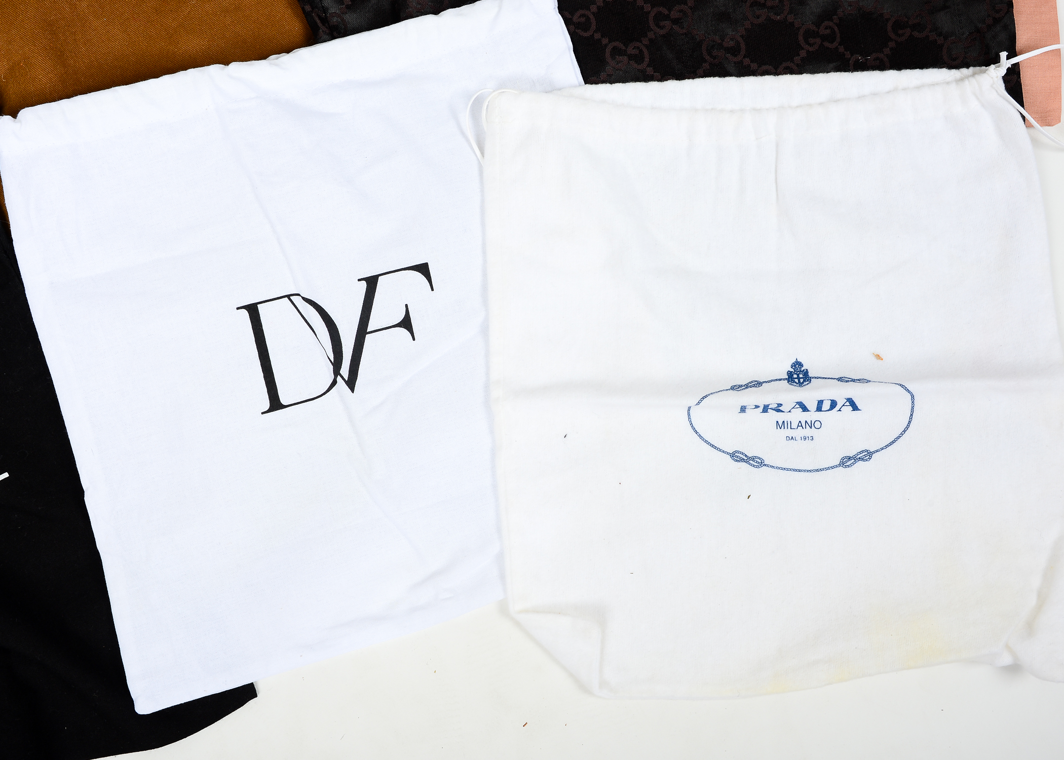 Collection of Dust Bags Featuring Prada, Chanel, Gucci, and More