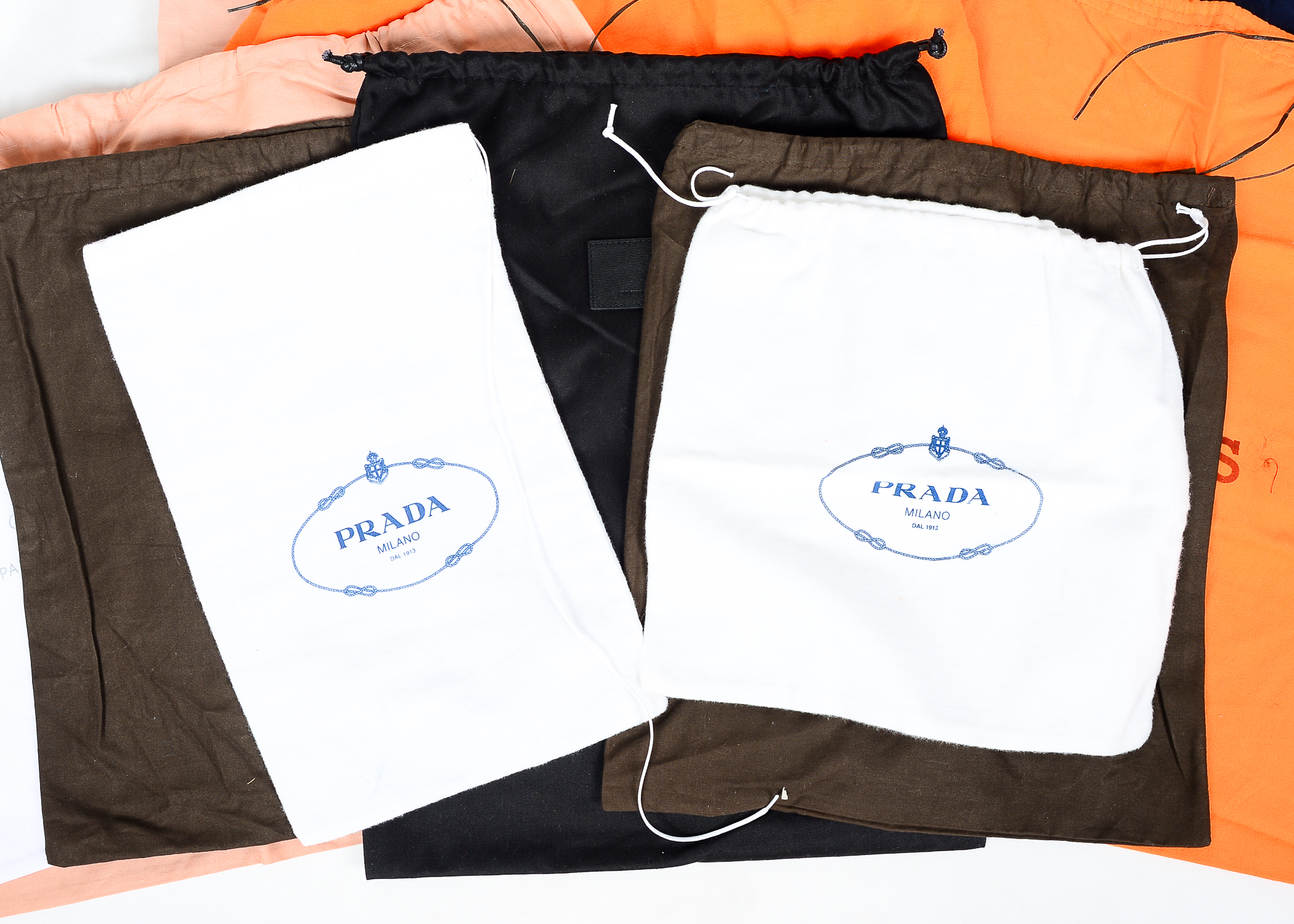 Collection of Dust Bags Featuring Prada, Chanel, Gucci, and More