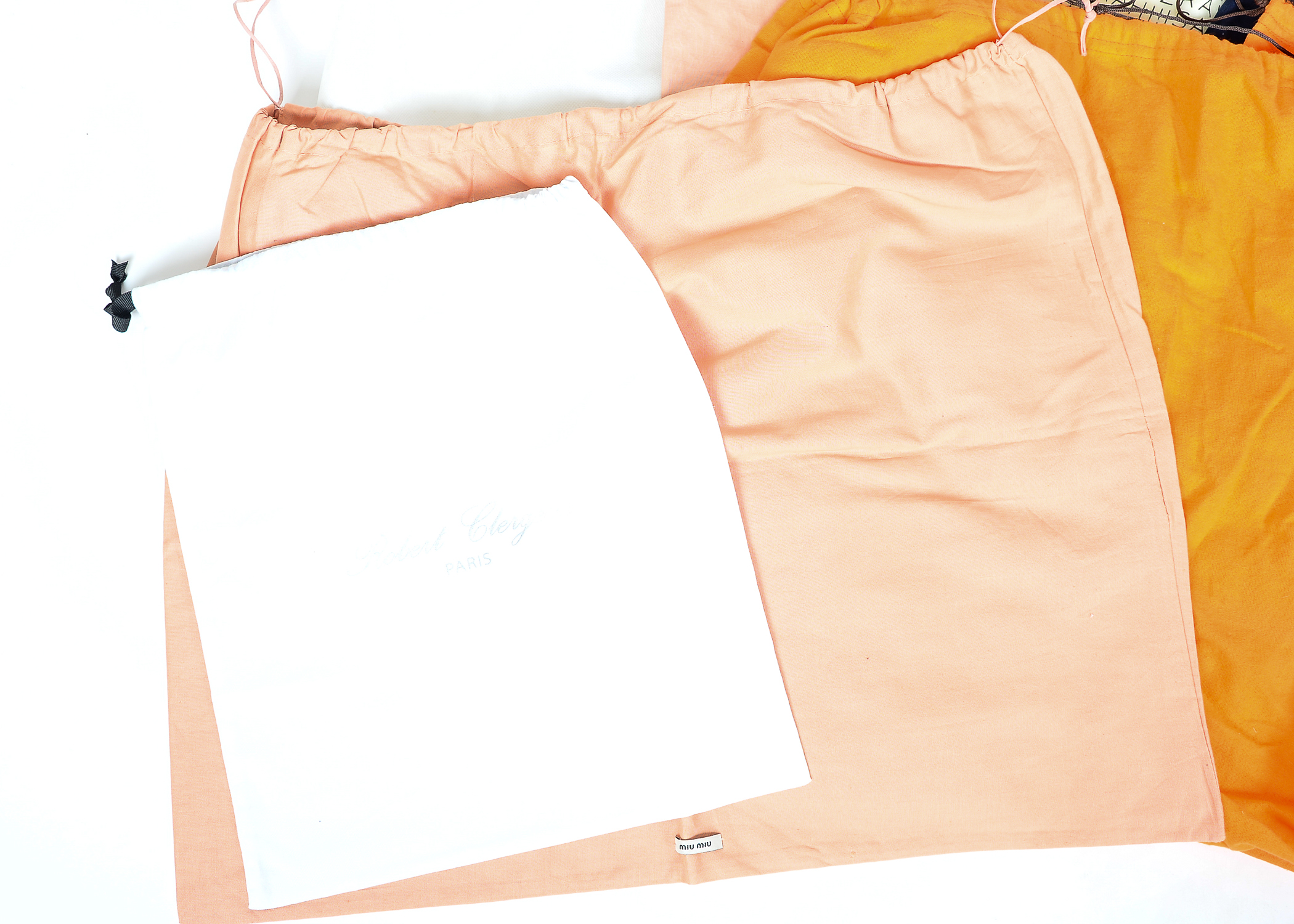 Collection of Dust Bags Featuring Prada, Chanel, Gucci, and More